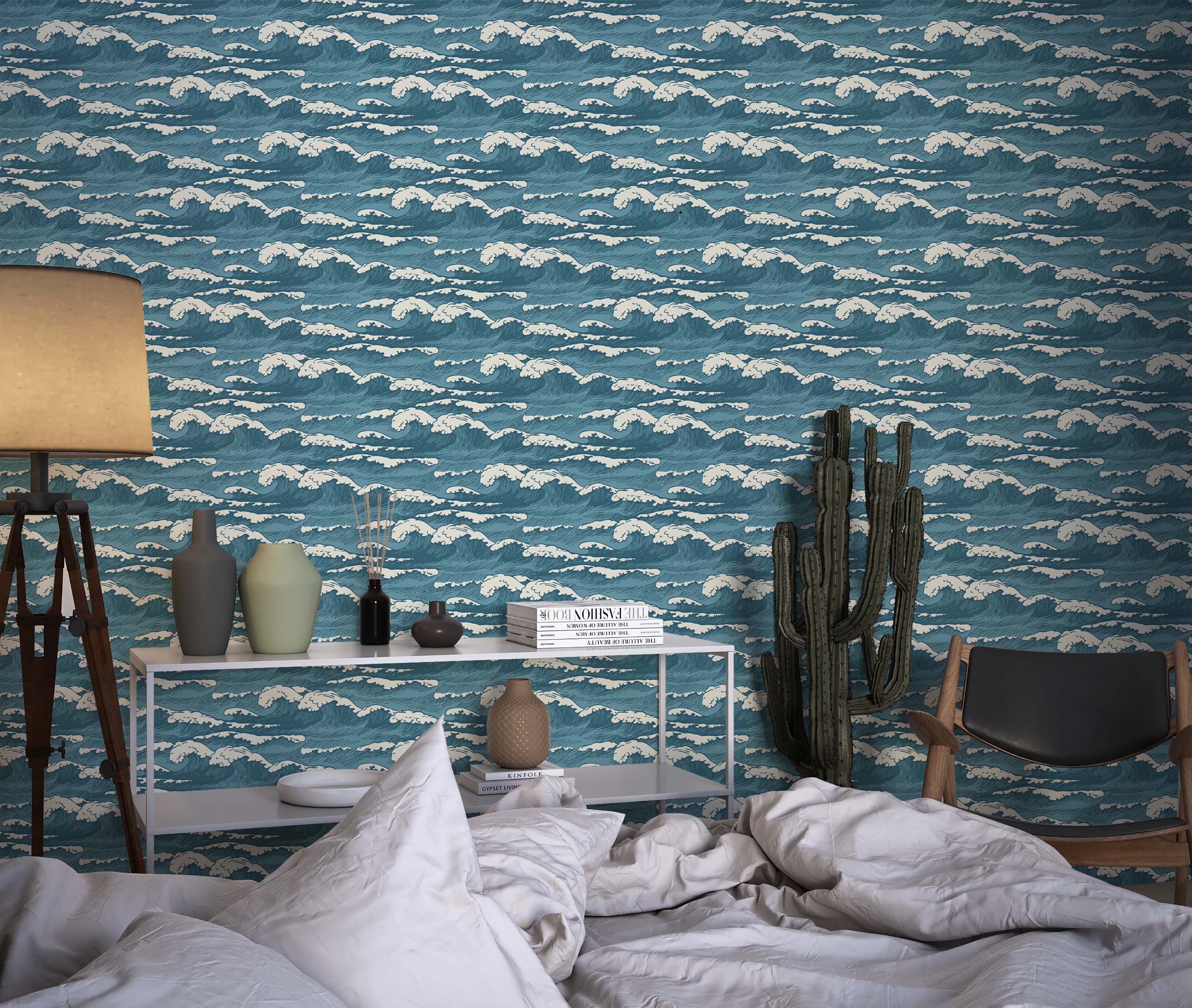 Wallpaper featuring a repeating pattern of stylized ocean waves in shades of blue and white, evoking a traditional Japanese art style.