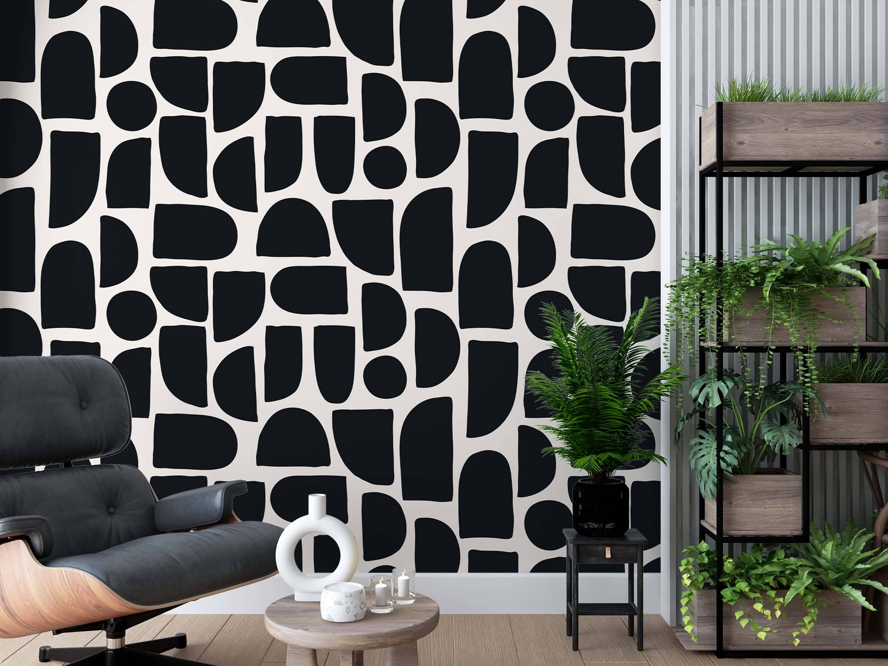 Wallpaper featuring abstract, irregular geometric shapes like semi-circles and rounded rectangles in black on a white background.