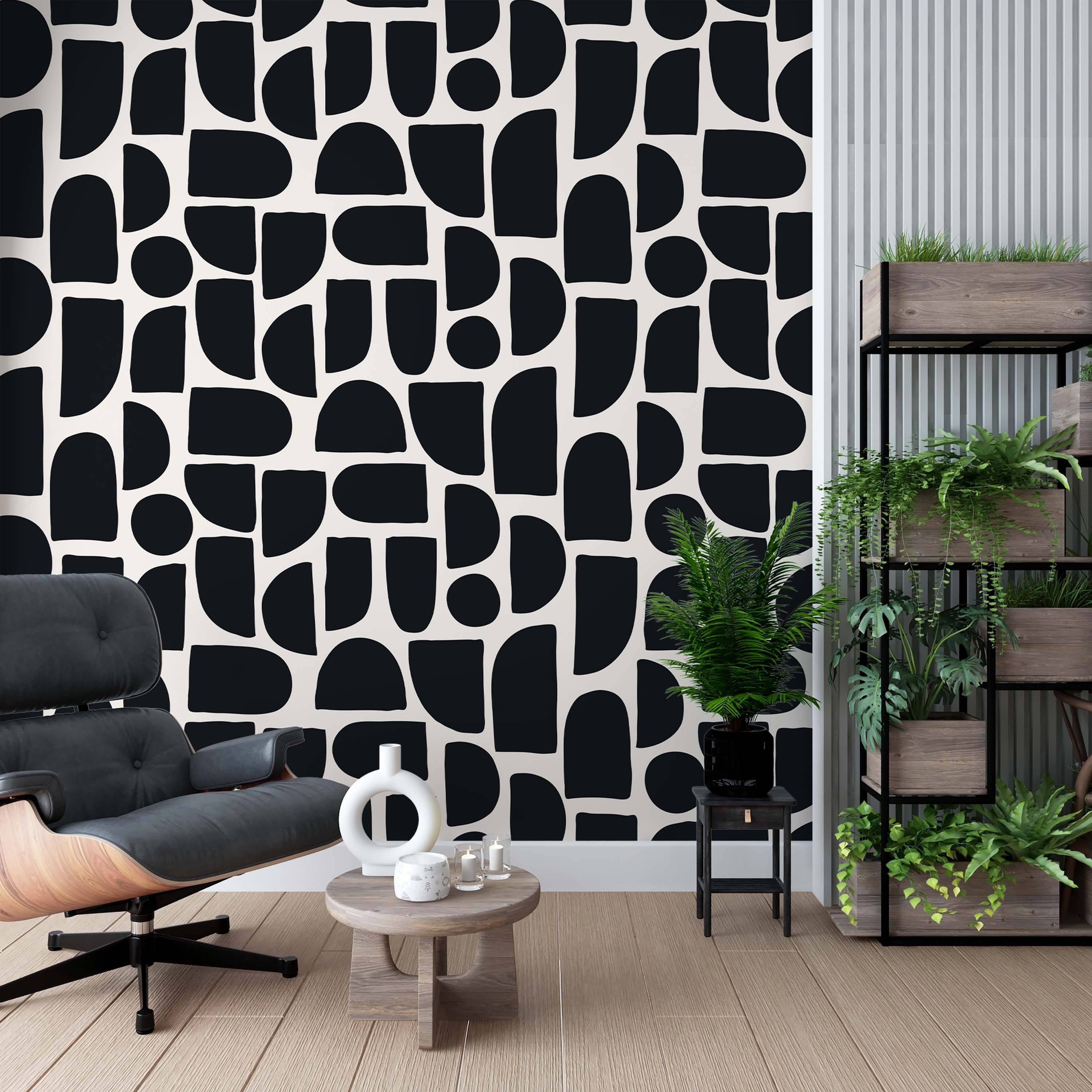 Wallpaper featuring abstract, irregular geometric shapes like semi-circles and rounded rectangles in black on a white background.