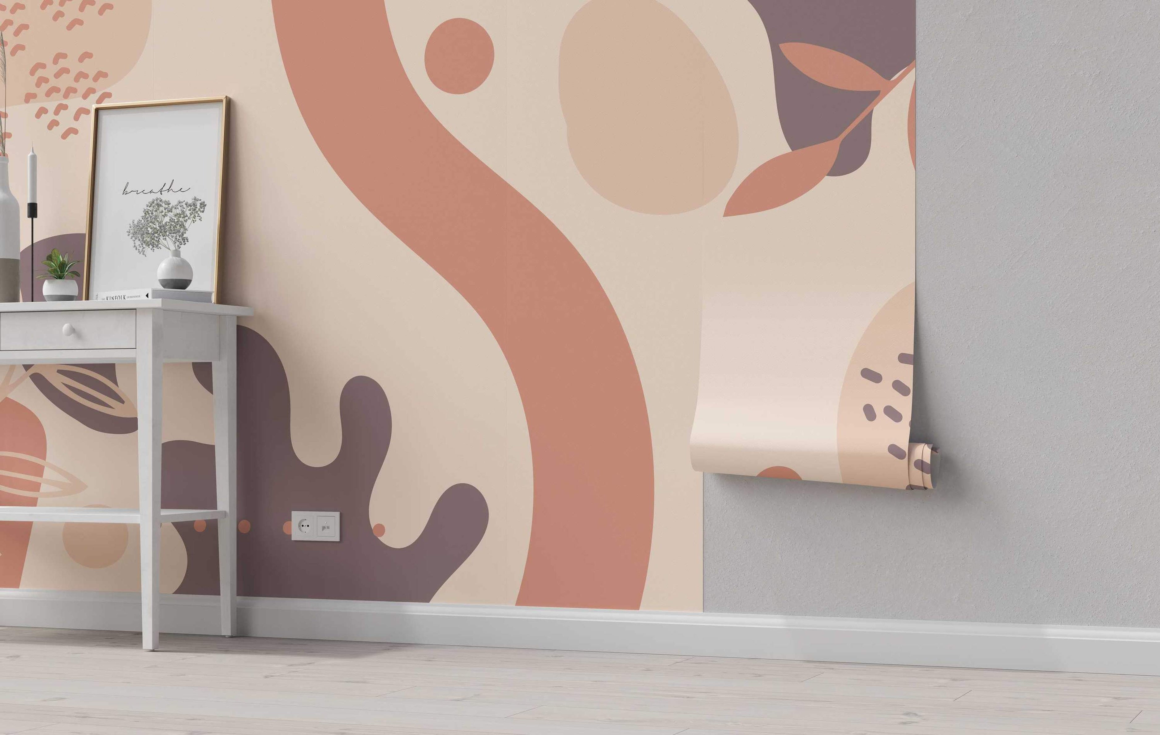 Abstract mural featuring large organic shapes and curves in terracotta pink, beige, and muted purple against a light cream background.