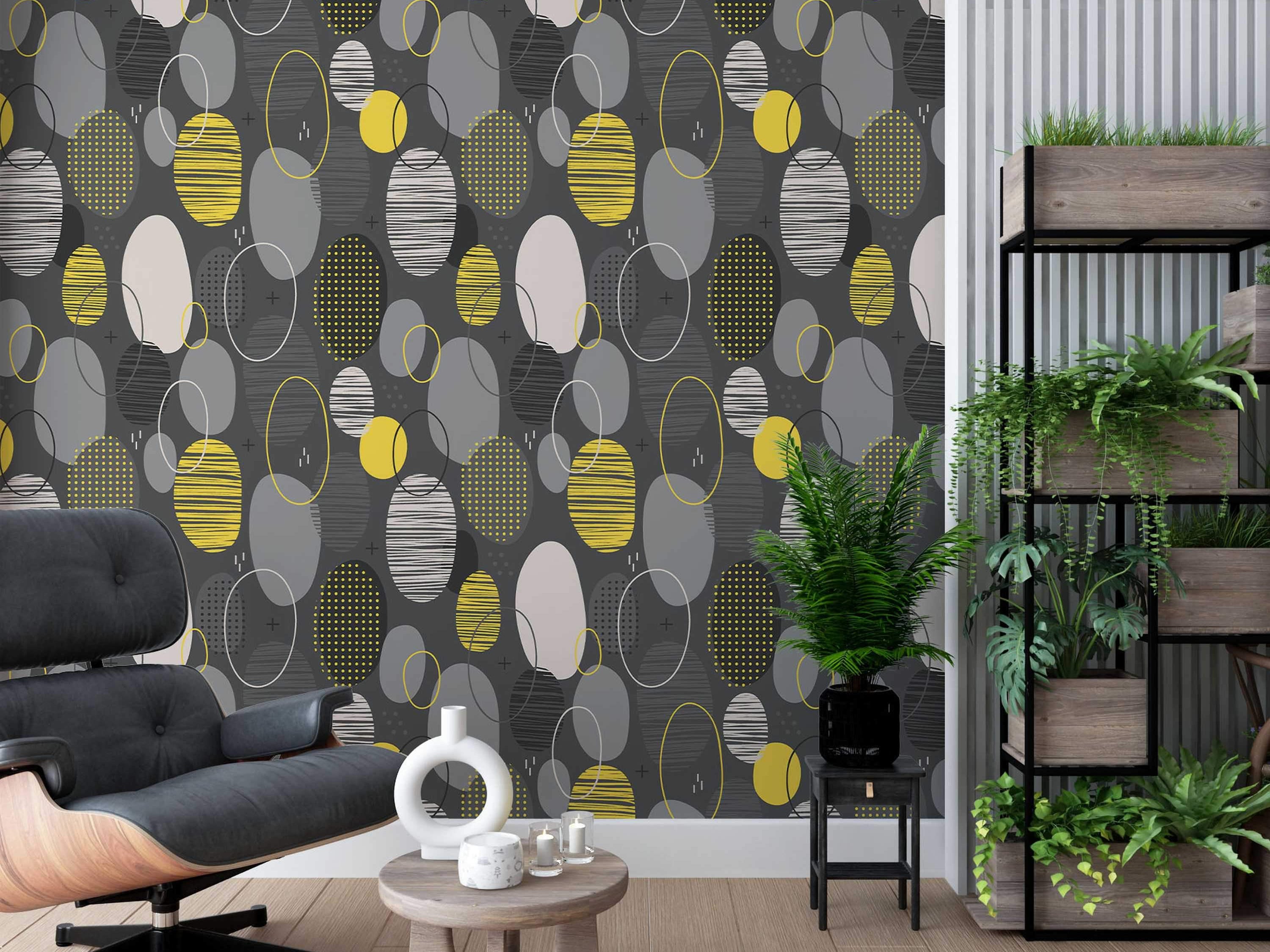Repeating wallpaper pattern of textured and solid ovals in yellow, white, and gray against a dark gray backdrop.