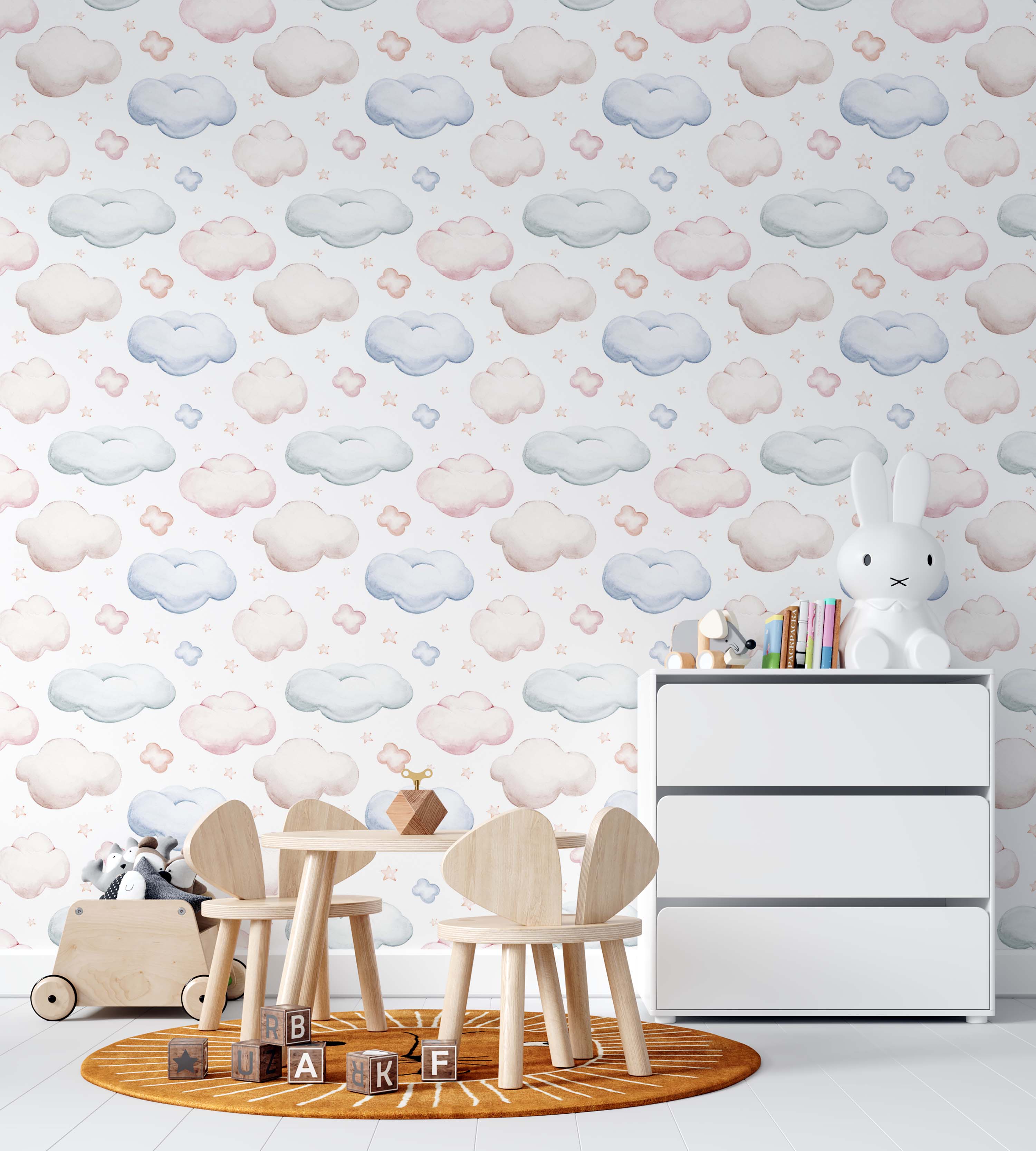 Whimsical wallpaper with soft pastel pink, blue, and light beige watercolor clouds and tiny peach-pink stars on a white background.
