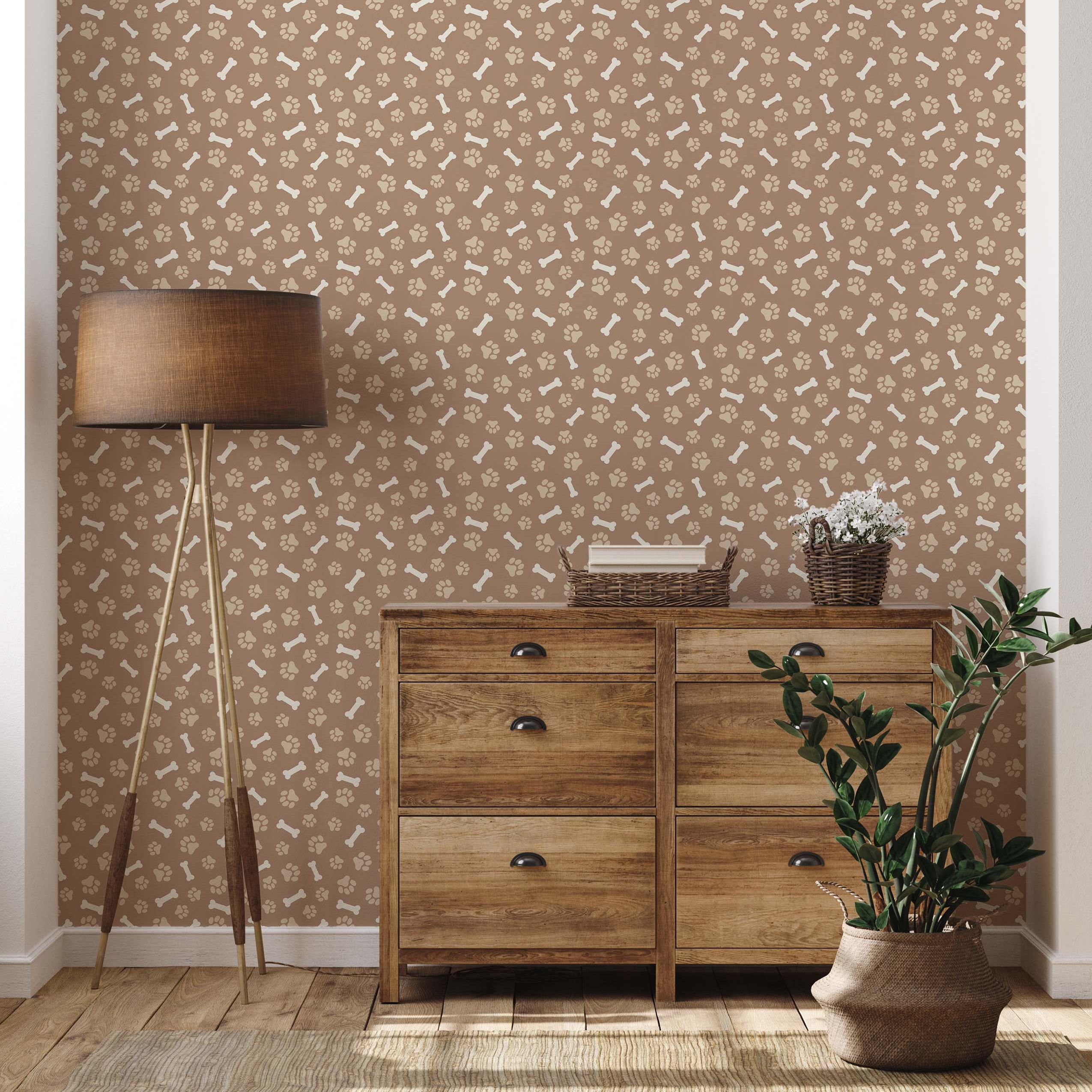 Brown wallpaper with a repeating pattern of beige dog paw prints and bones.