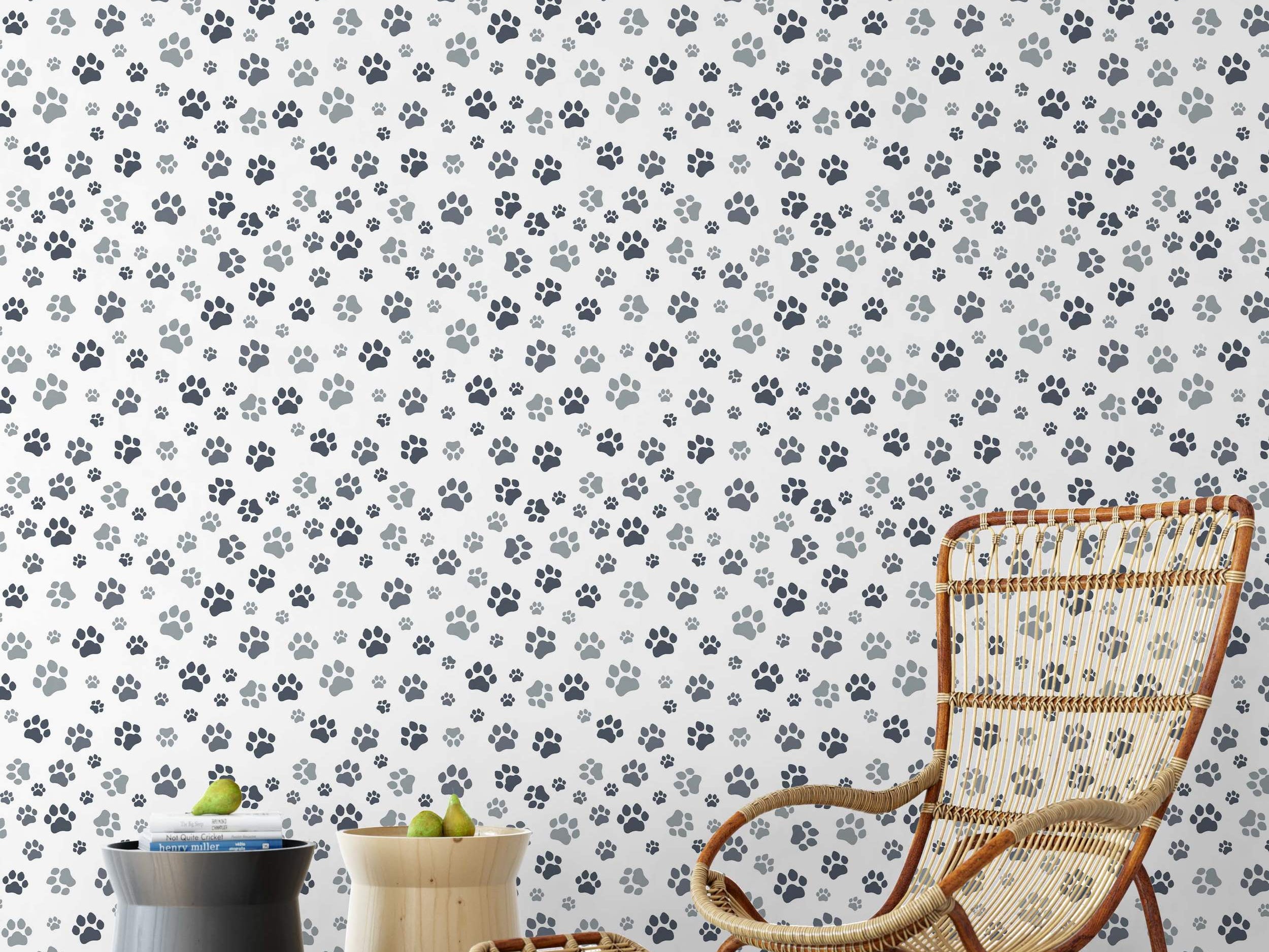Gray and black paw print wallpaper in a repeating pattern