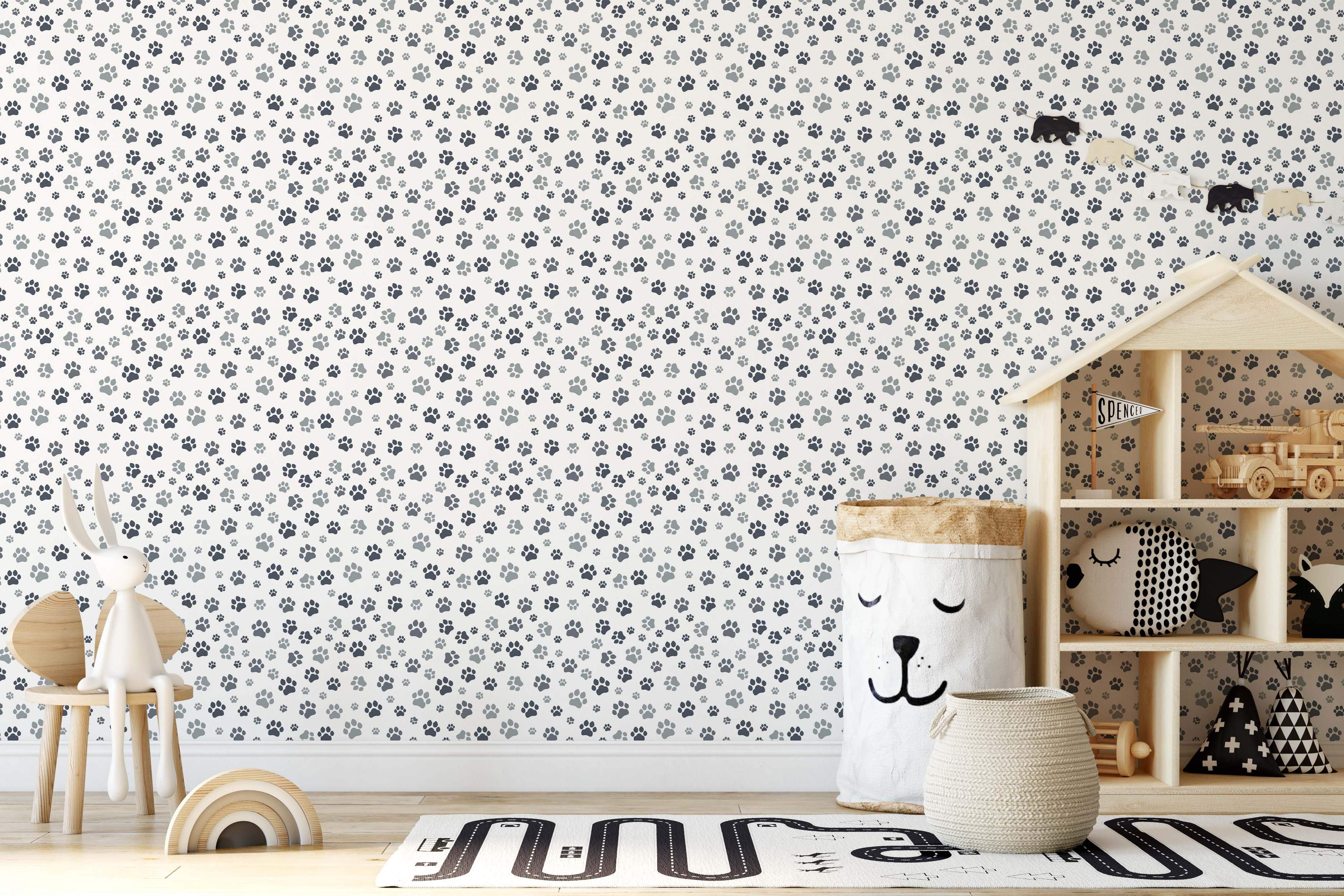 Paw print pattern in black and gray on white wallpaper