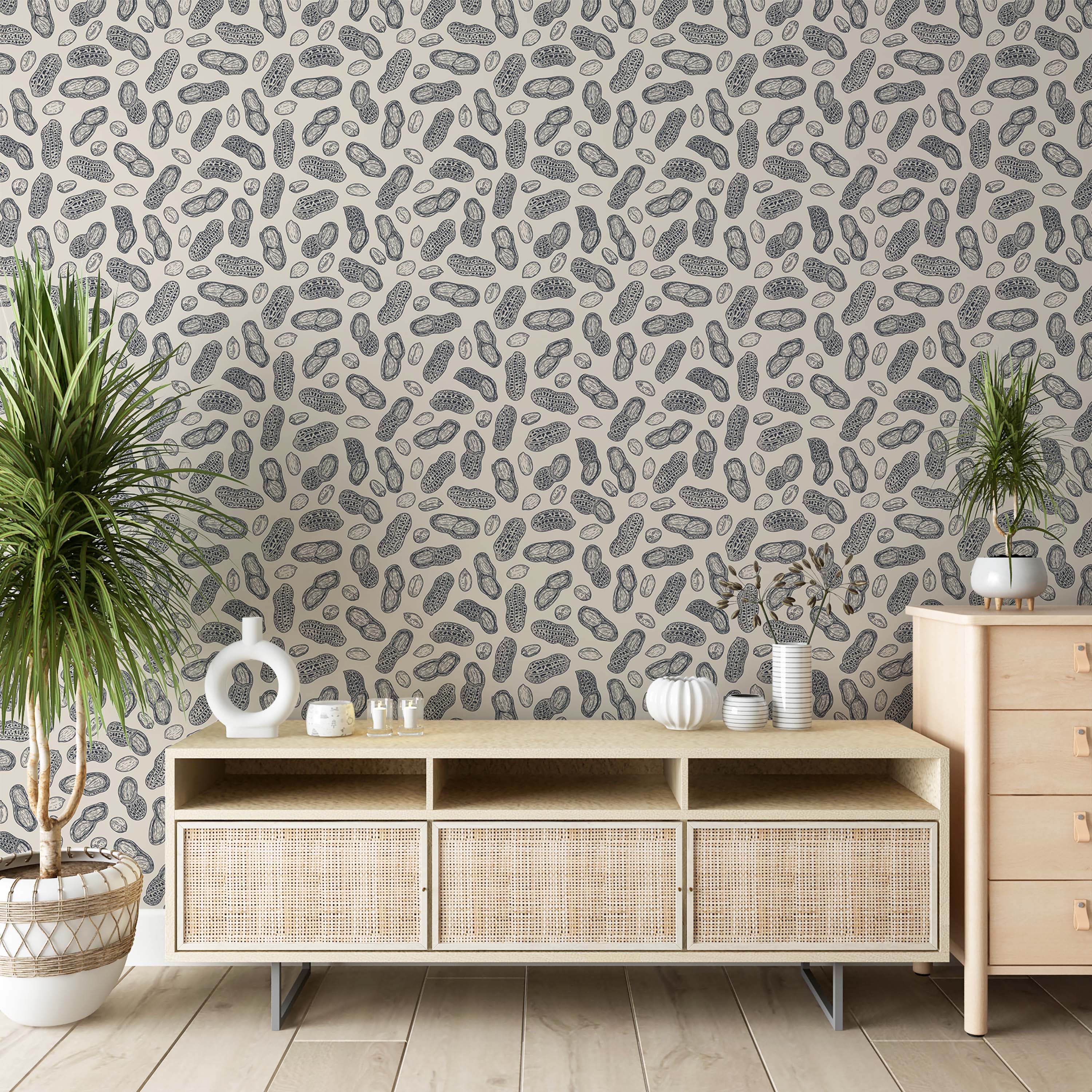 Wallpaper with a repeating pattern of hand-drawn dark gray peanuts on a light beige background.