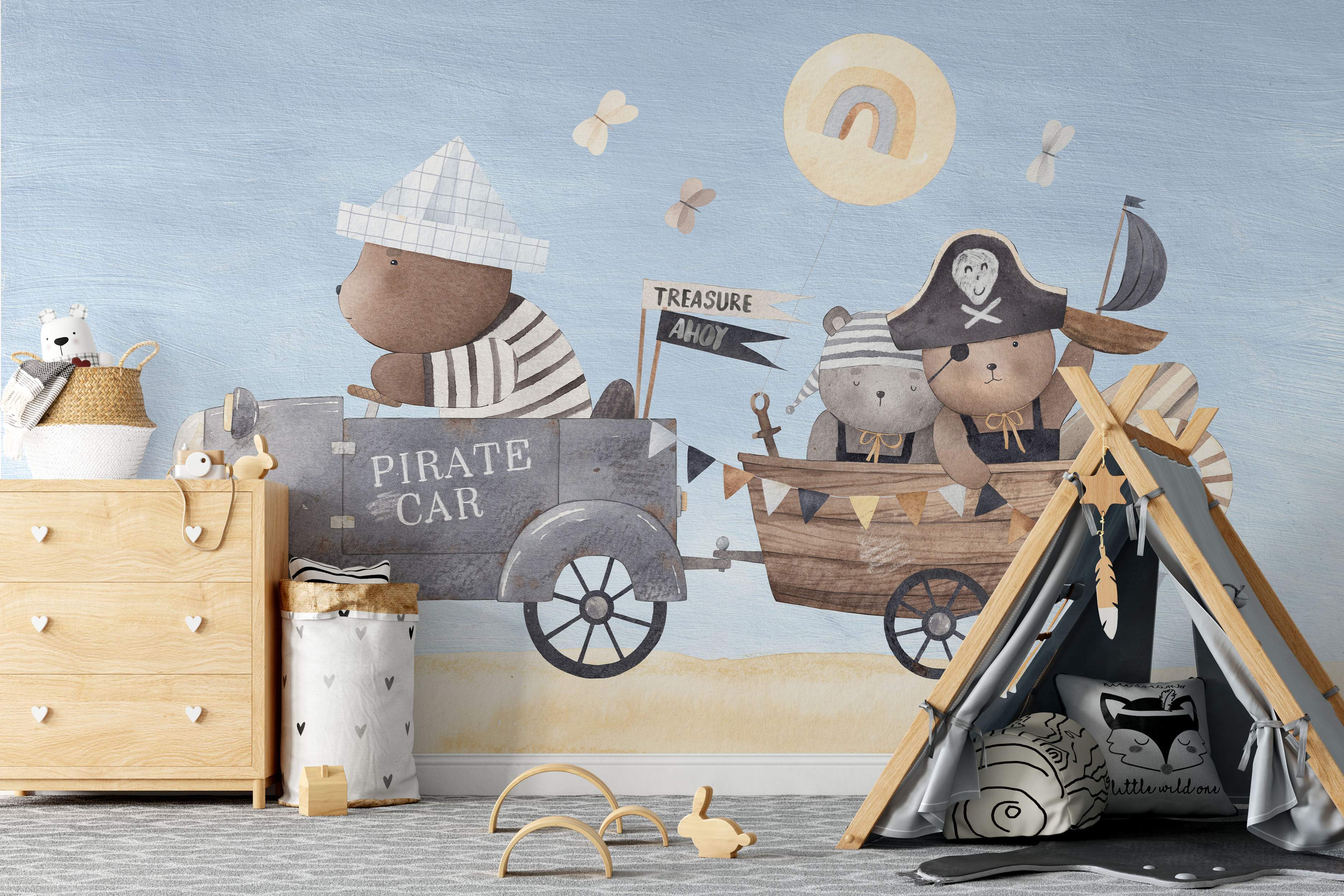 Charming watercolor mural of pirate teddy bears in a car and boat trailer on a beach, with a light blue sky backdrop.