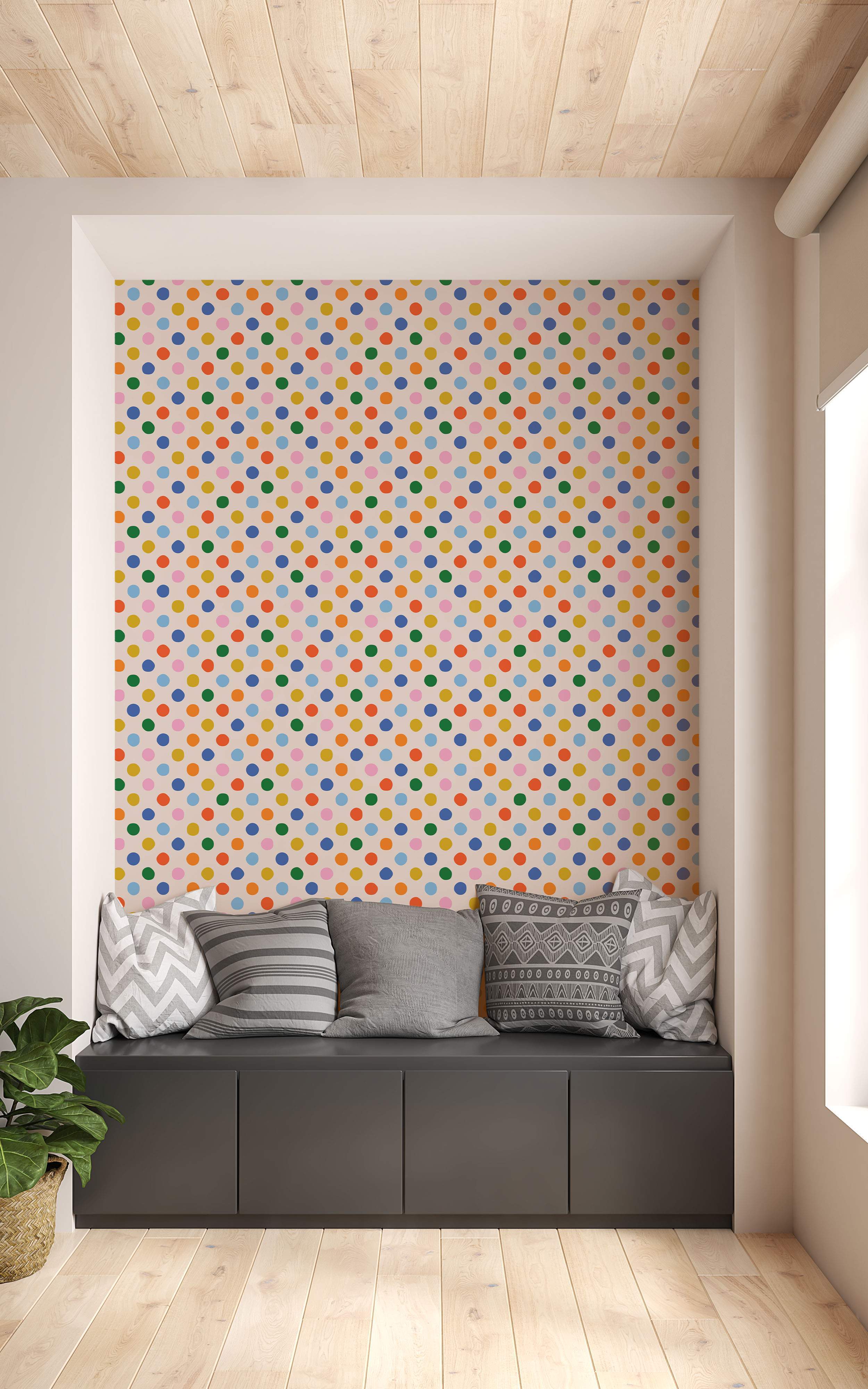 Wallpaper featuring a repeating pattern of multicolor polka dots in red, orange, yellow, green, blue, and pink on a light background.