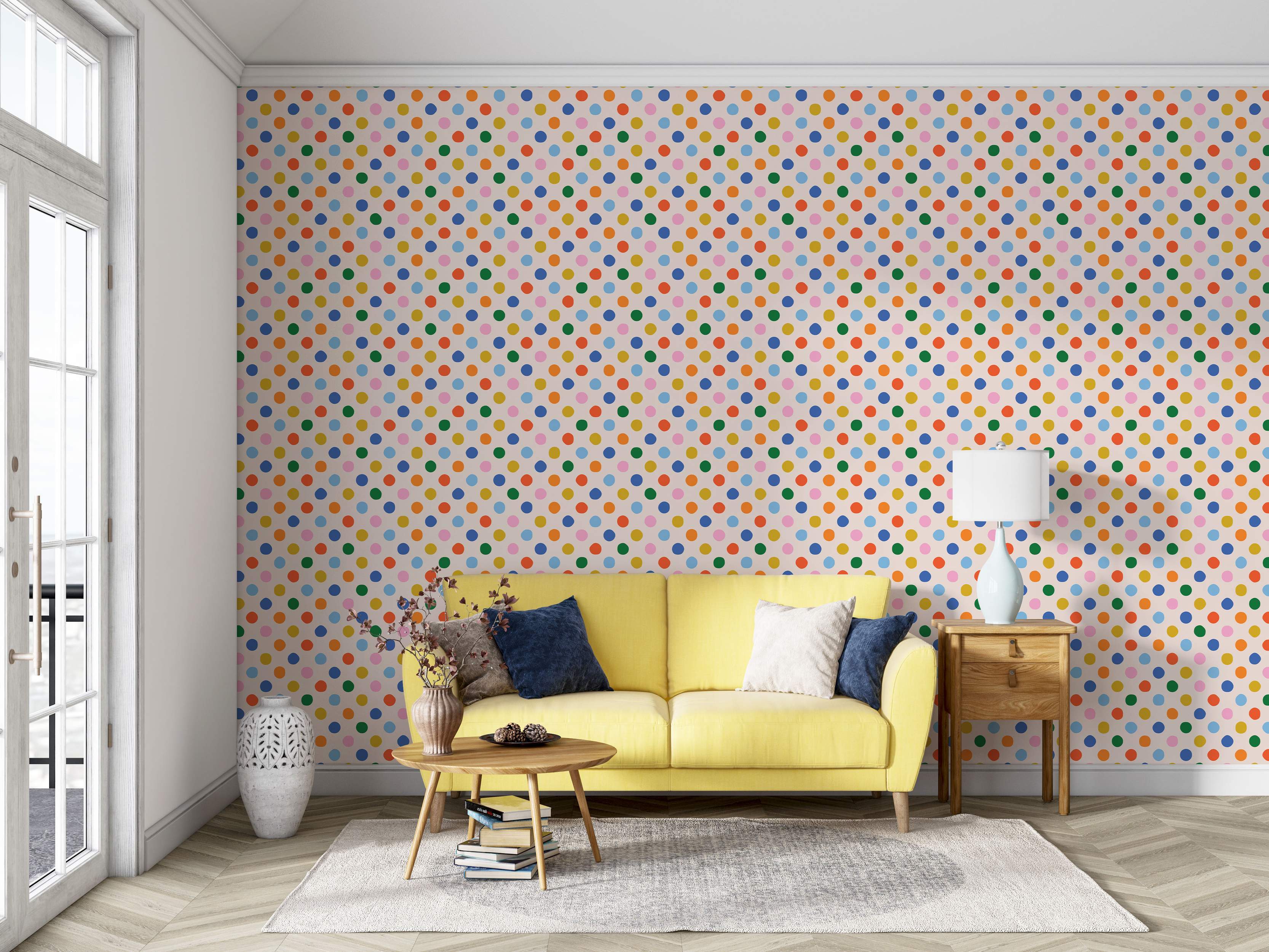 Wallpaper with a repeating pattern of multicolor polka dots (orange, yellow, green, blue, pink) on a light cream background.