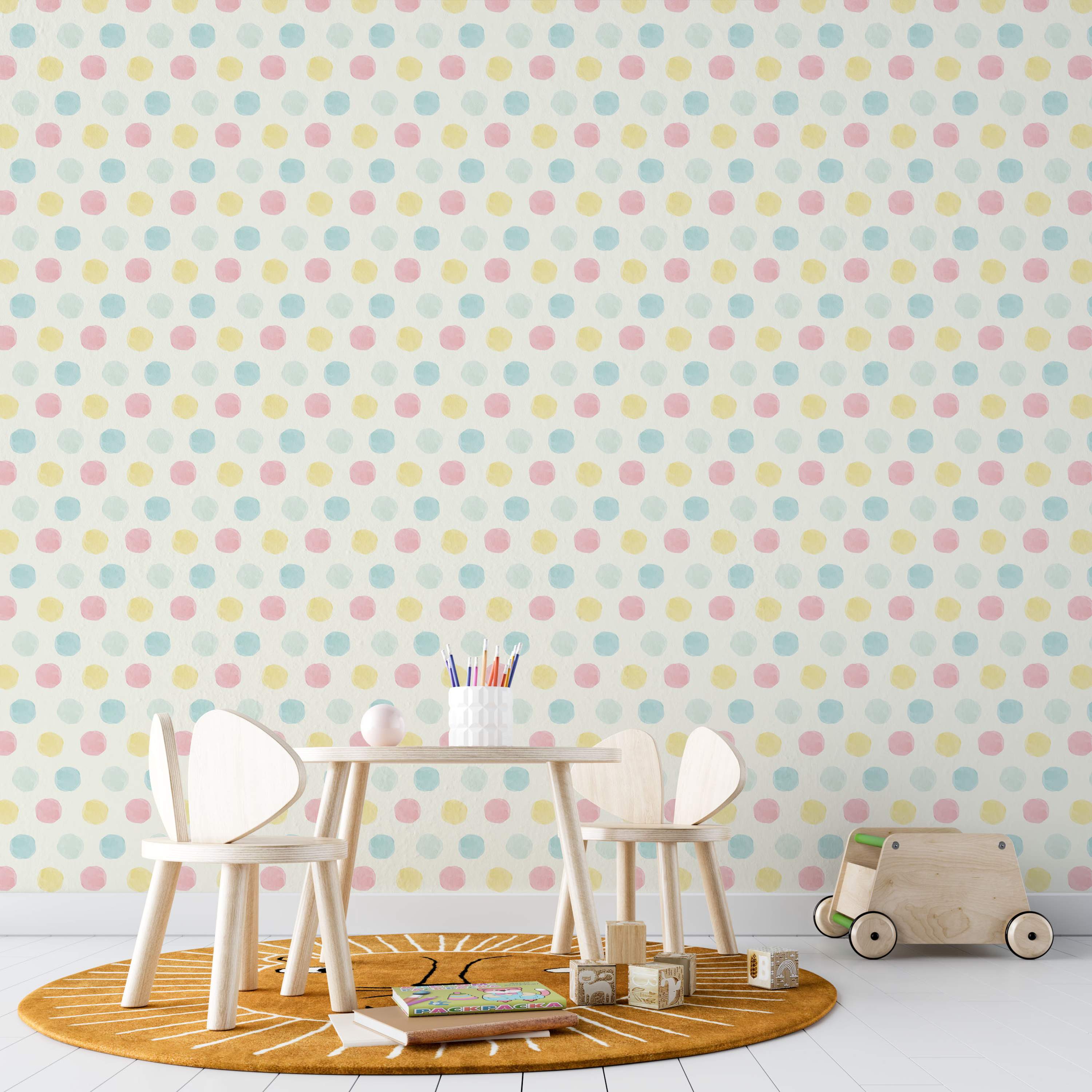 Cream wallpaper featuring repeating pastel pink, yellow, and blue watercolor-style polka dots.