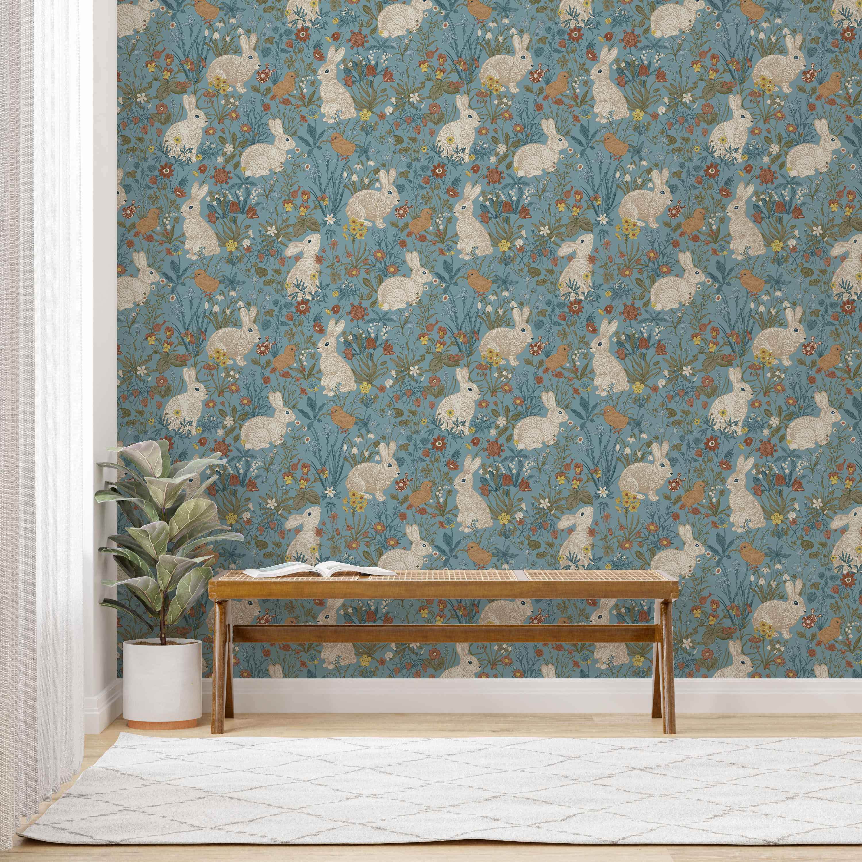 Whimsical wallpaper featuring illustrated white rabbits and brown birds among colorful flowers and green foliage on a muted blue background.
