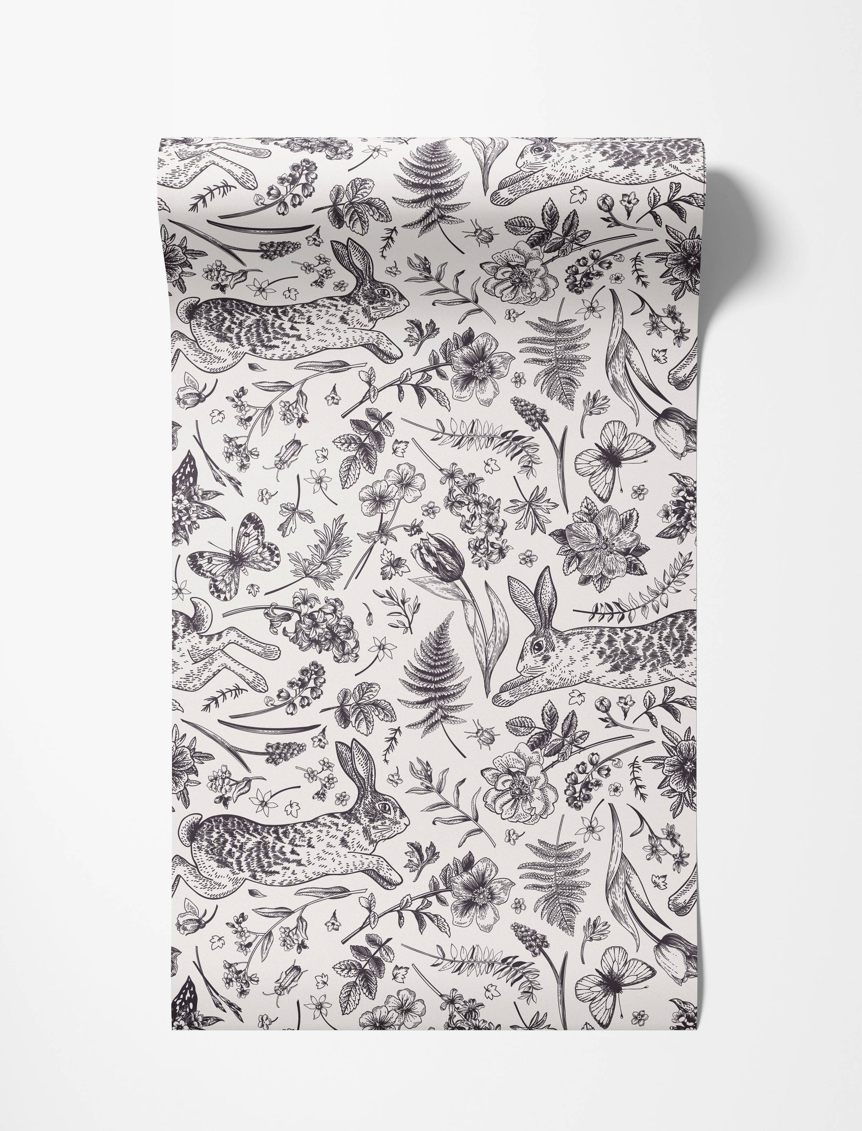 A vintage-style wallpaper featuring a black and white line drawing pattern of rabbits, butterflies, ferns, and flowers.