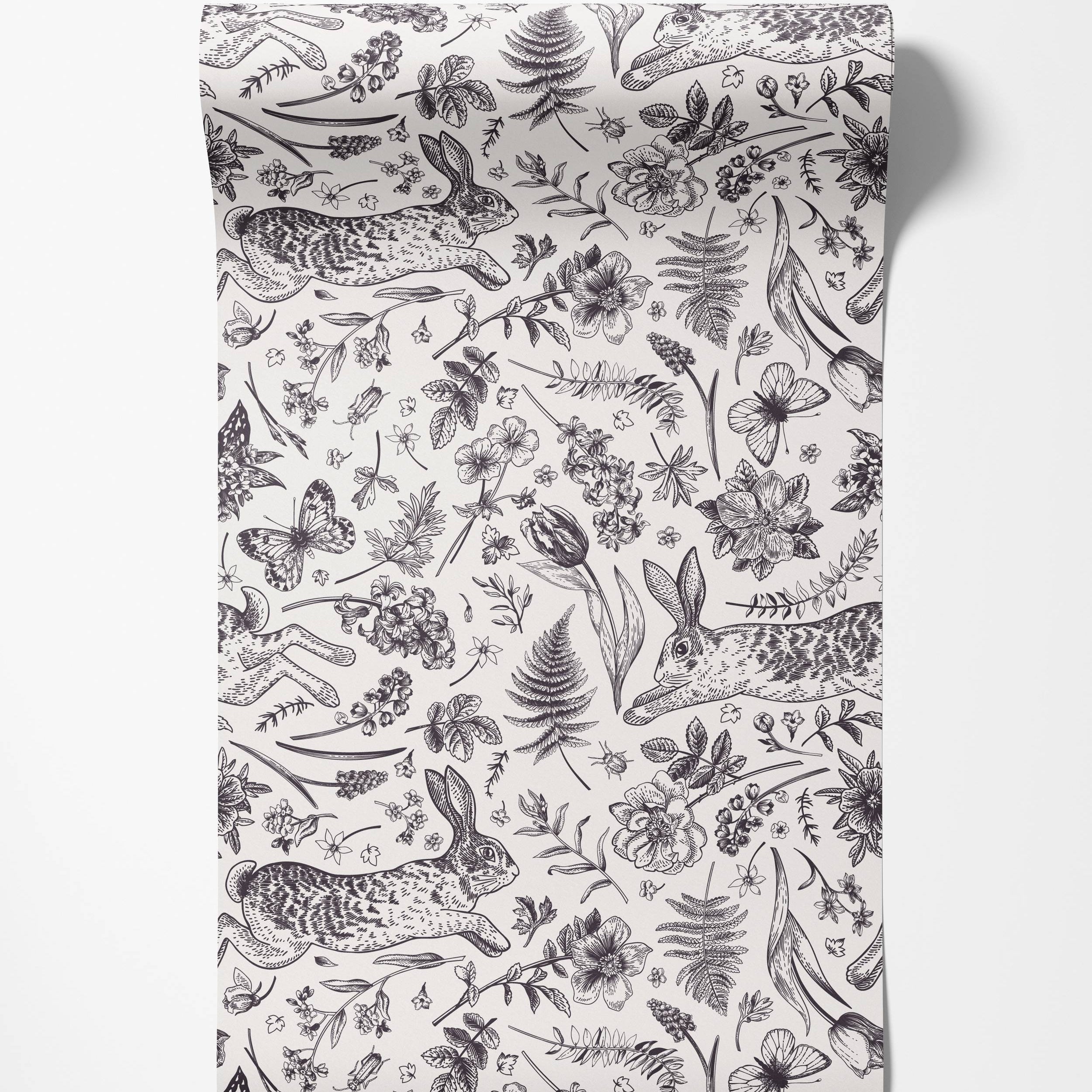 A vintage-style wallpaper featuring a black and white line drawing pattern of rabbits, butterflies, ferns, and flowers.