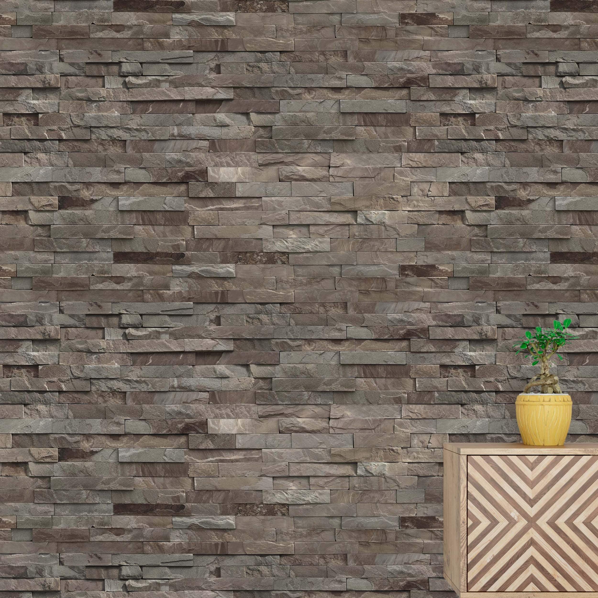 Wallpaper with a natural stacked ledger stone design featuring textured rectangular stones in brown and gray tones.