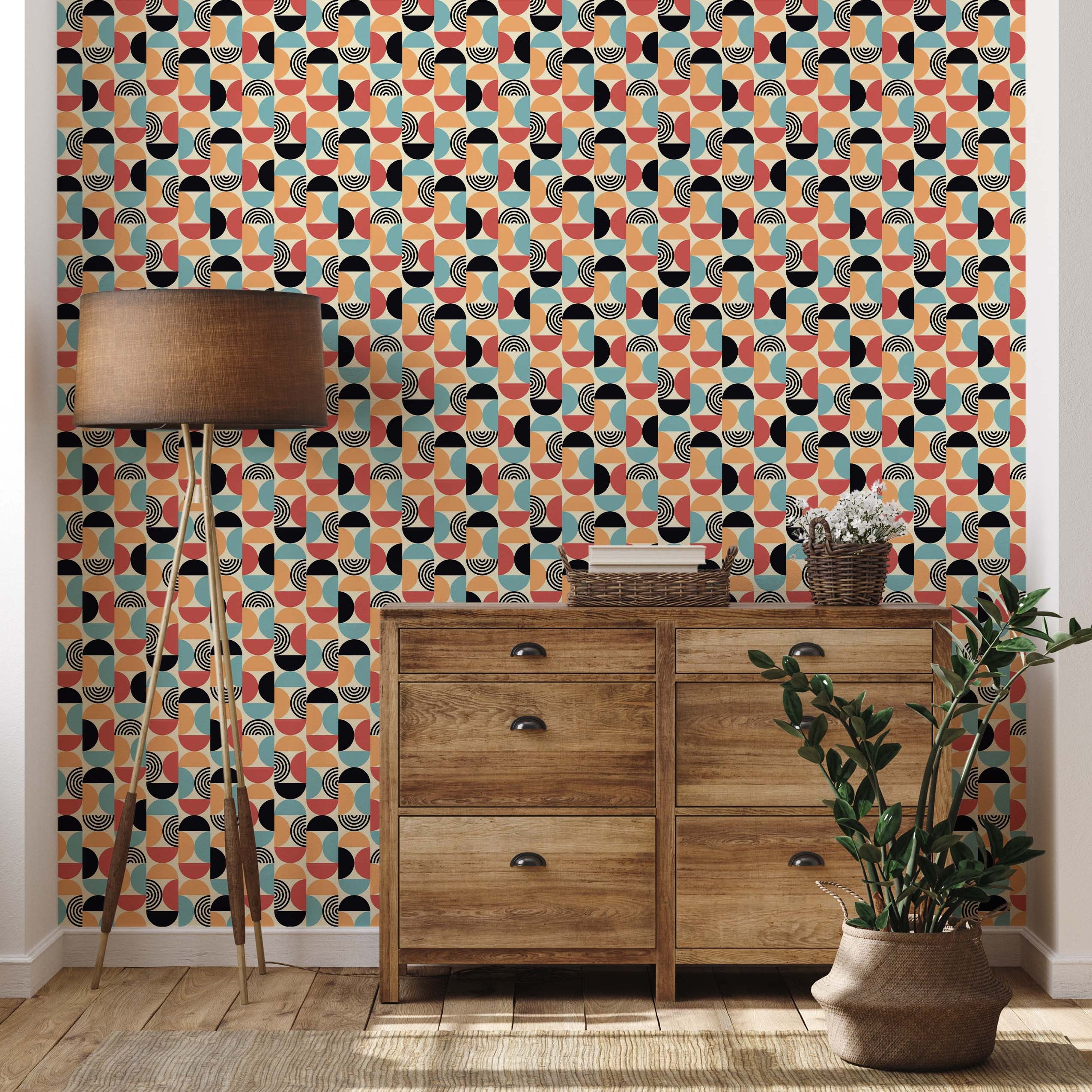 Retro geometric wallpaper featuring a repeating pattern of ovals composed of red-orange, teal, black, and cream semicircles with line details.