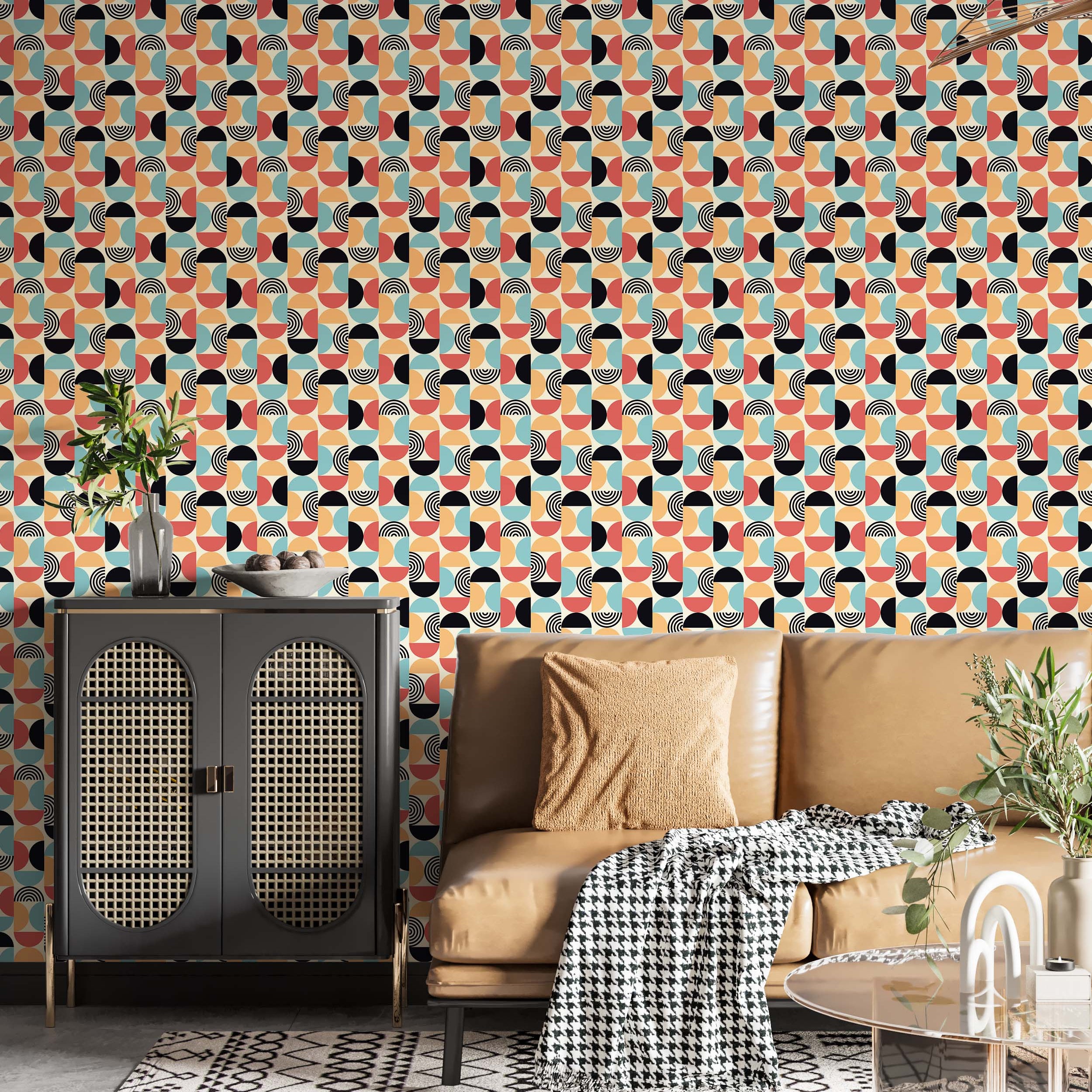 Retro geometric wallpaper with repeating segmented ovals in red-orange, light blue, orange, black, and beige.