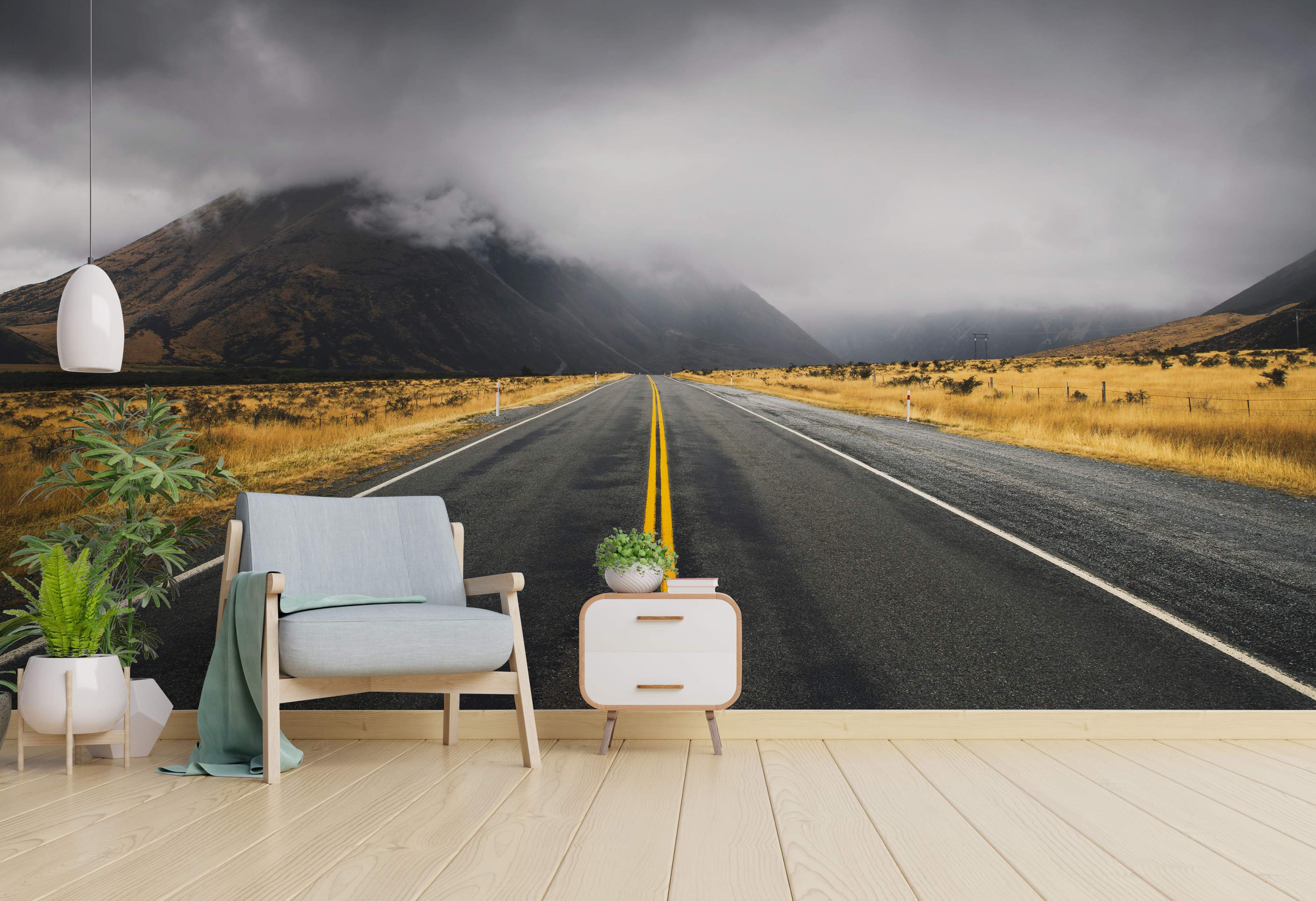 Open road leading to misty mountains mural with overcast sky