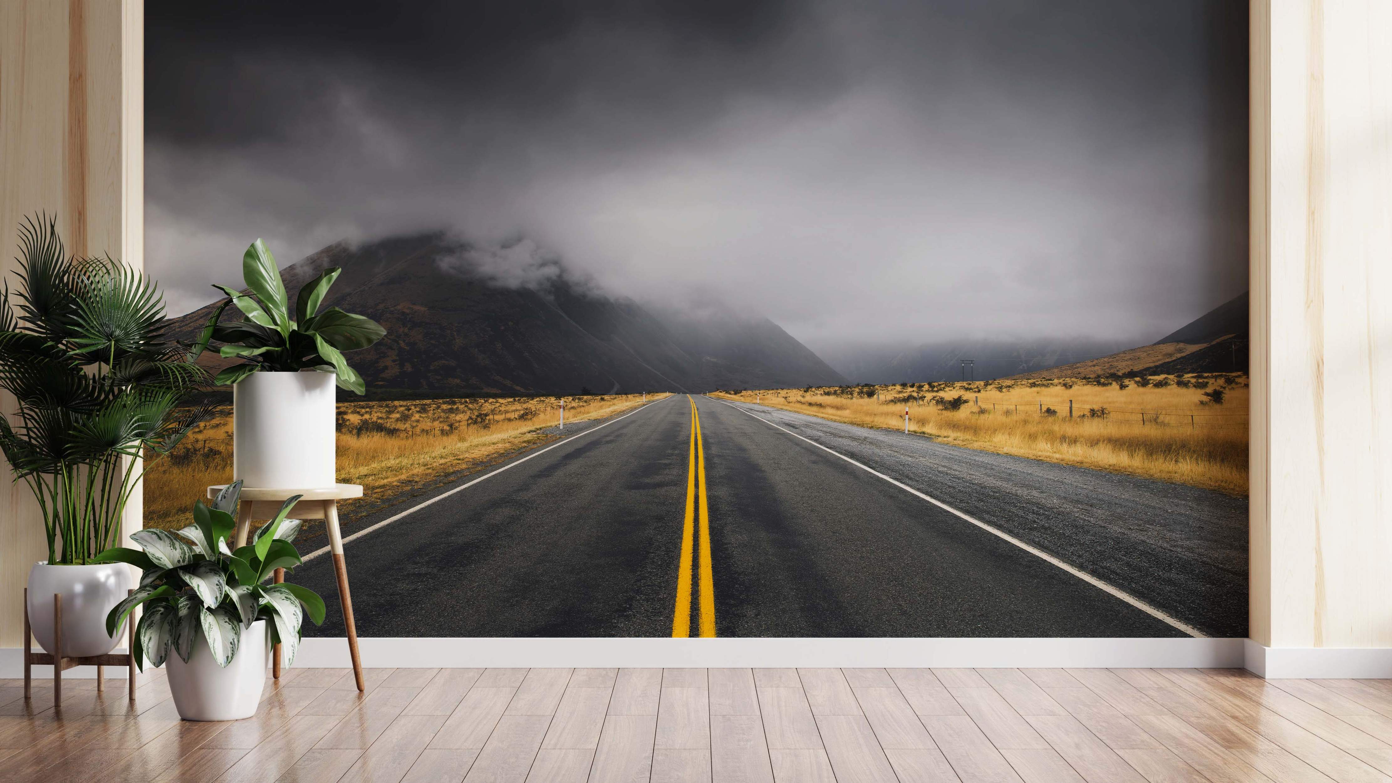 Landscape mural of a road with yellow lines and misty mountains