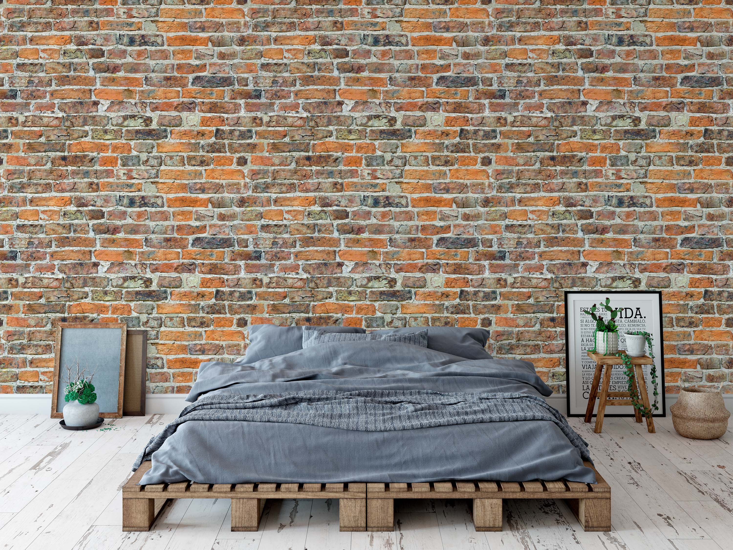 Rustic wallpaper with a realistic brick pattern in shades of red, orange, and brown, showing weathered texture and light mortar.