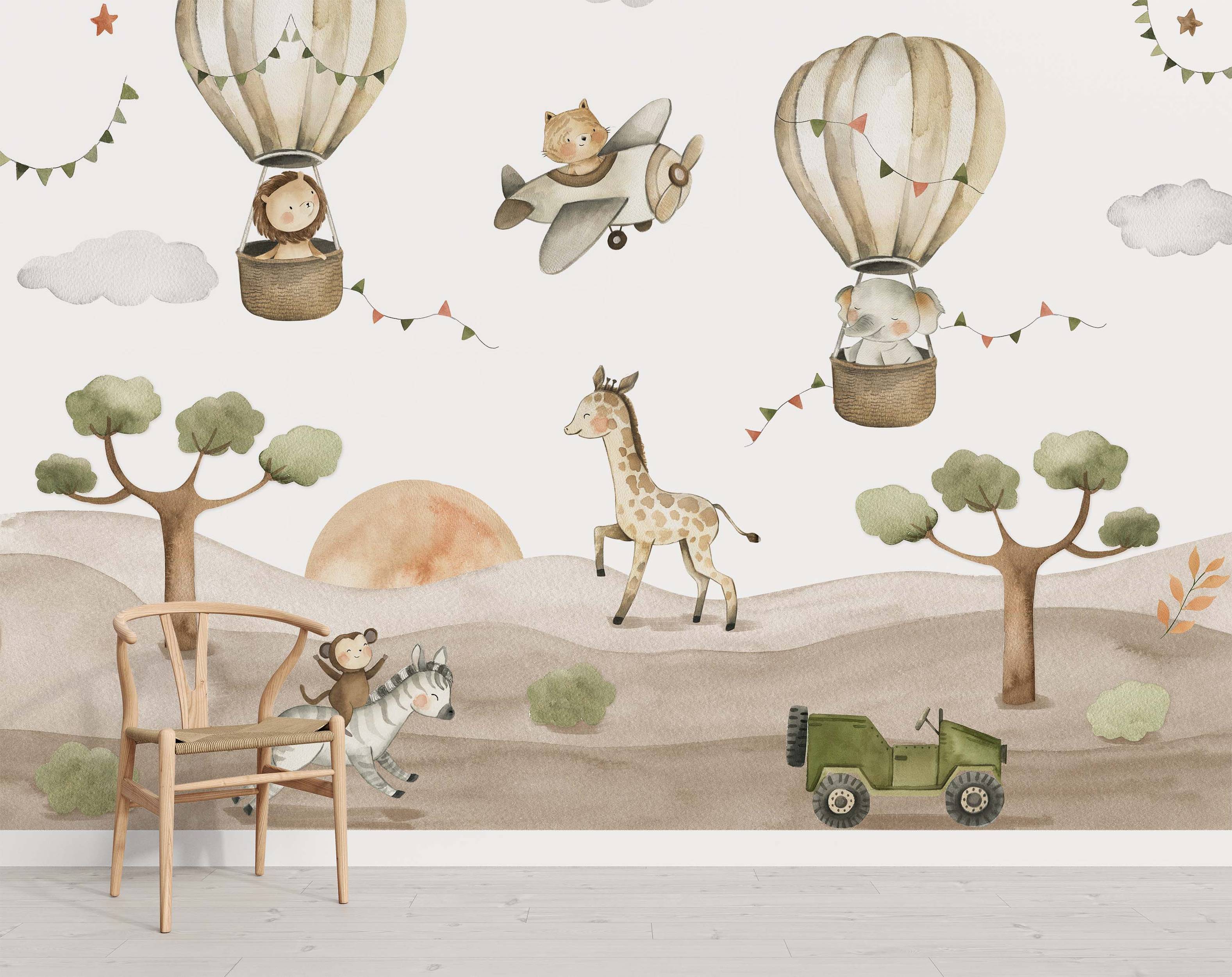 Watercolor safari mural with animals in hot air balloons (lion, elephant), a cat in an airplane, giraffe, monkey on zebra, and a jeep.