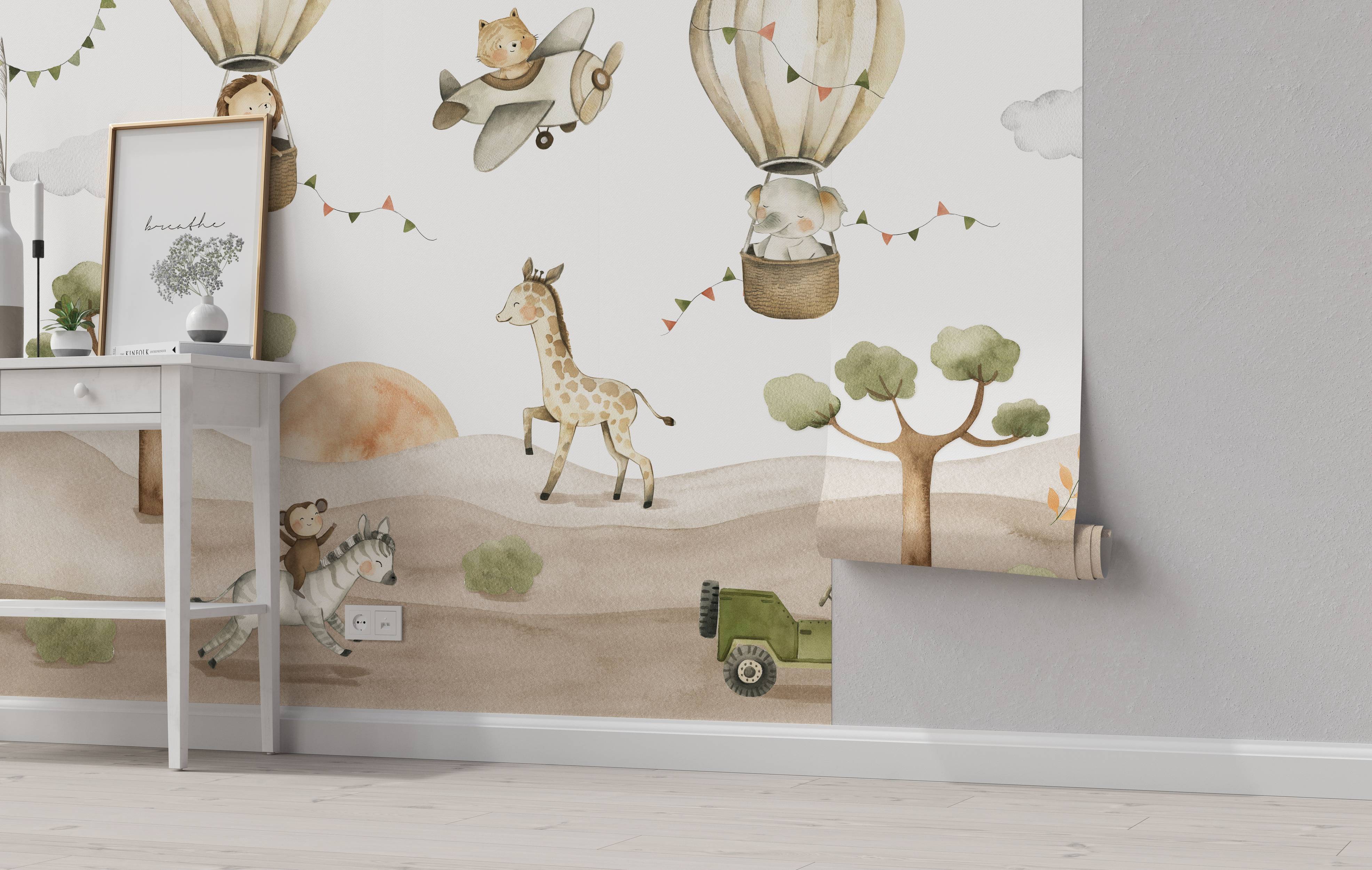 Watercolor mural depicting a whimsical safari scene with animals, hot air balloons, and an airplane in soft, earthy tones.