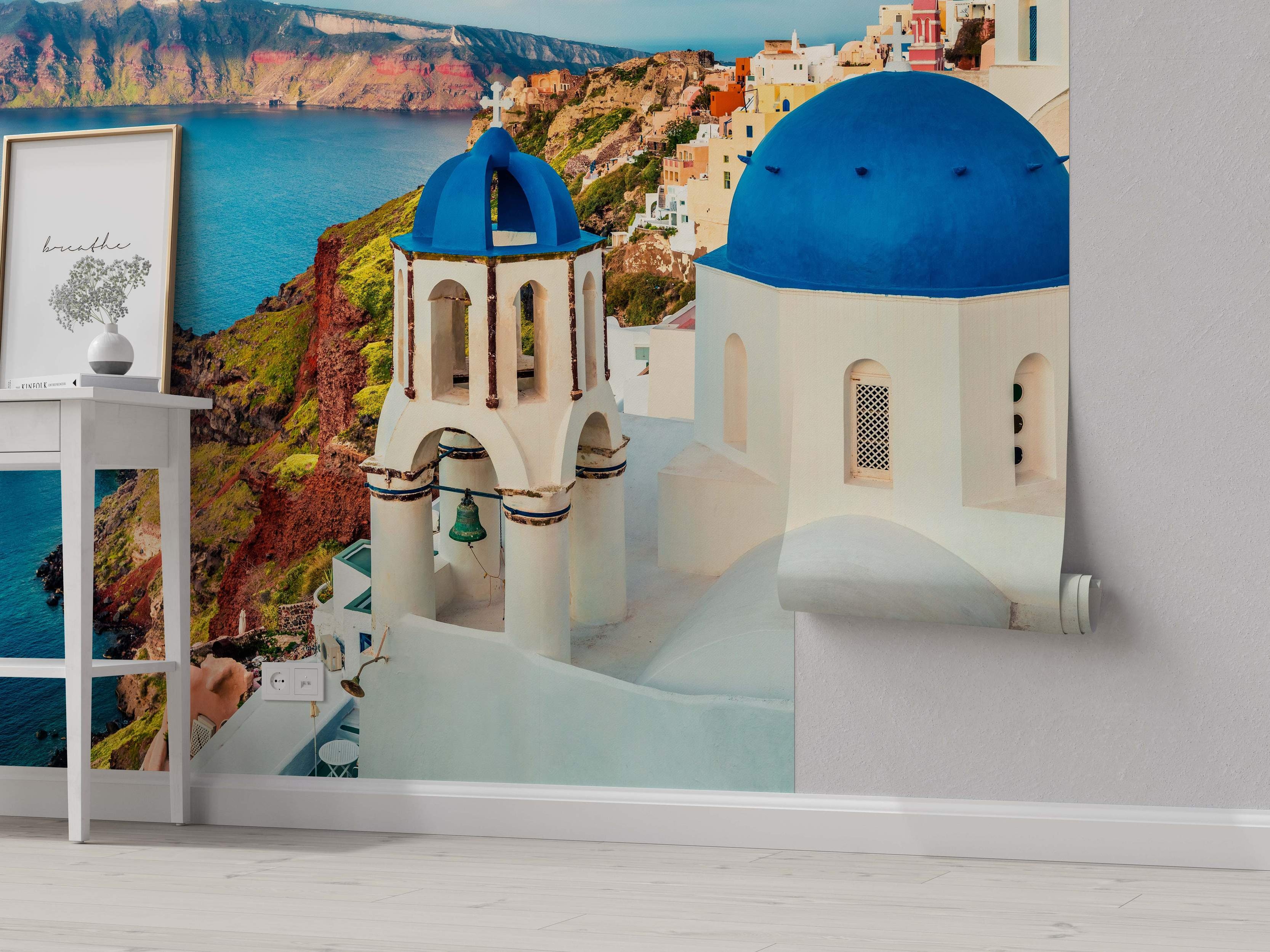Photorealistic mural of a Santorini scene featuring white buildings with blue domes overlooking the blue sea and caldera cliffs.