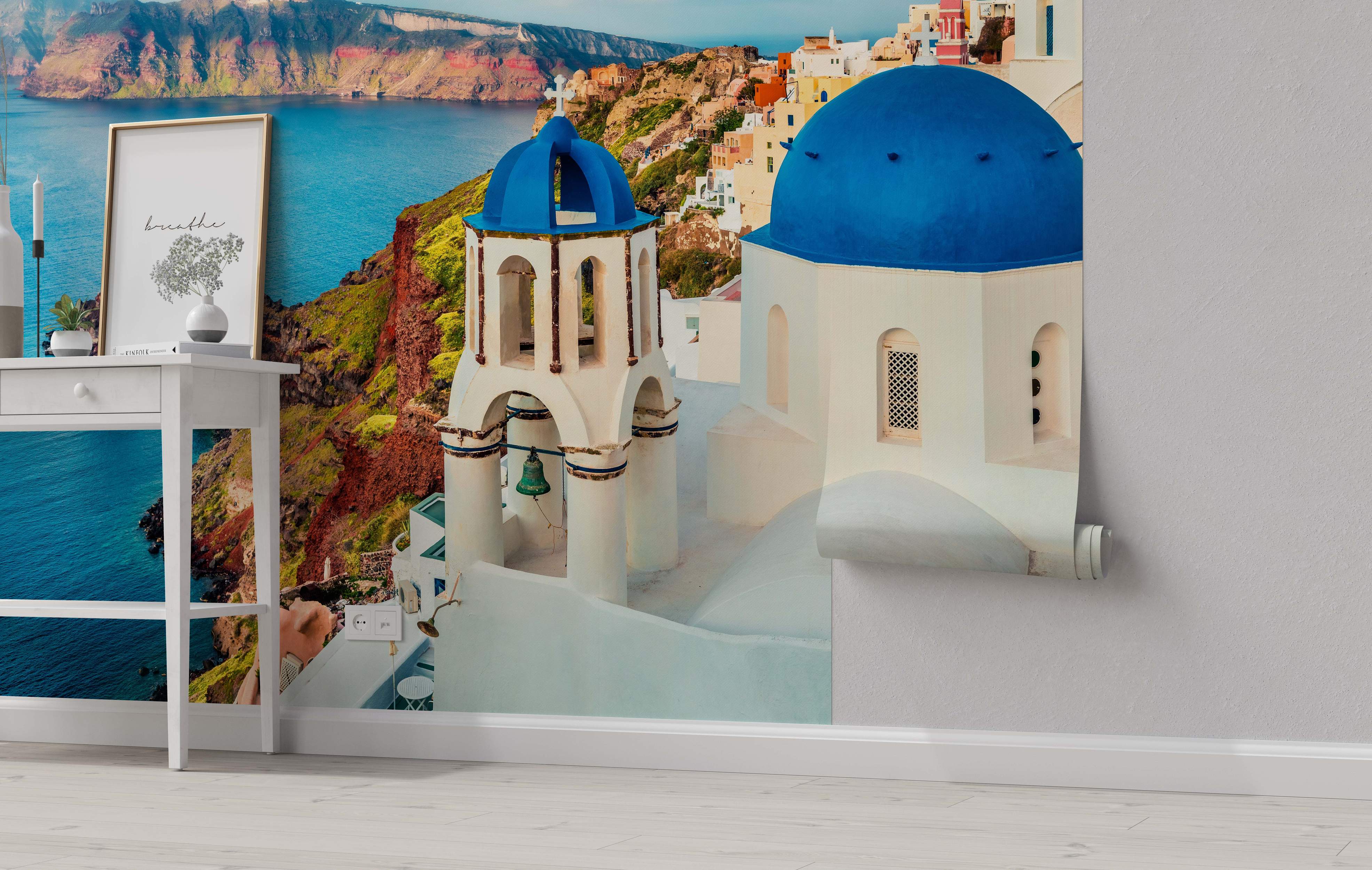 Photorealistic mural of a Santorini scene featuring white buildings with blue domes overlooking the blue sea and caldera cliffs.