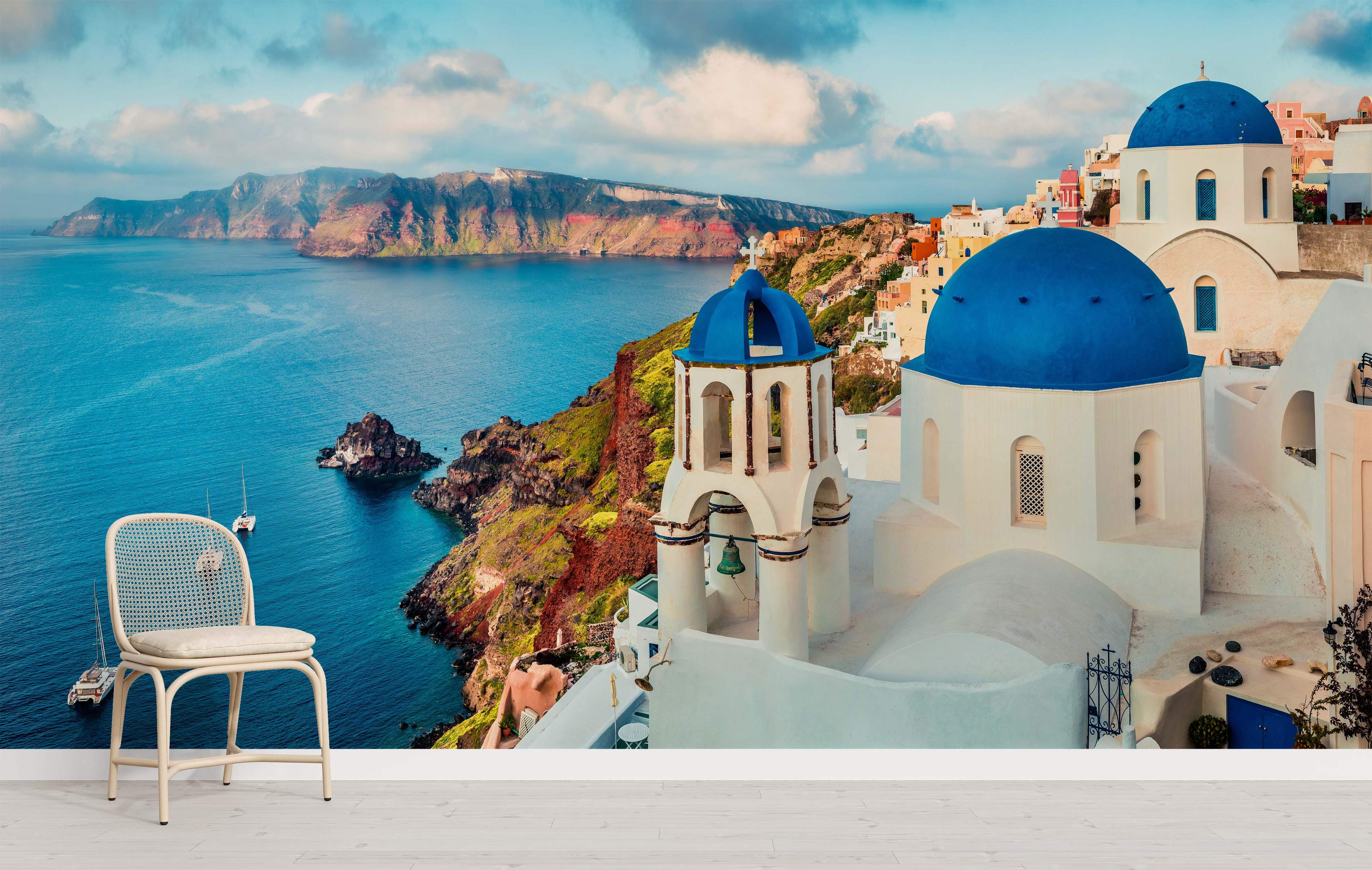 Mural depicting the iconic white buildings and blue-domed churches of Santorini perched on cliffs above the Aegean Sea.