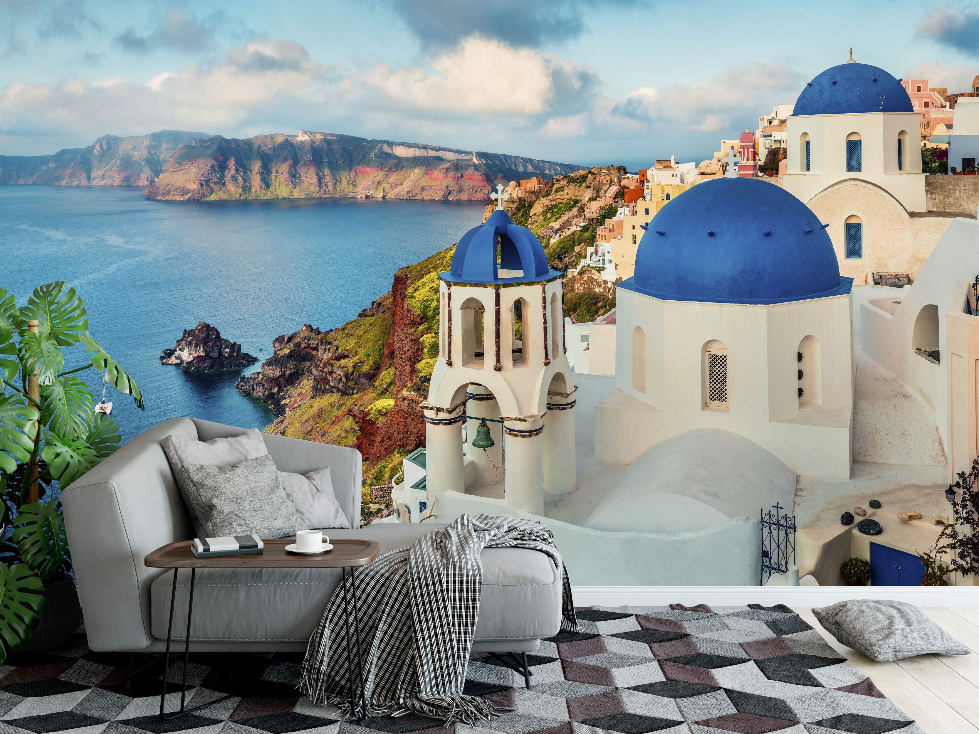 Scenic mural depicting the iconic white buildings and blue-domed churches of Santorini overlooking the blue caldera sea and cliffs.