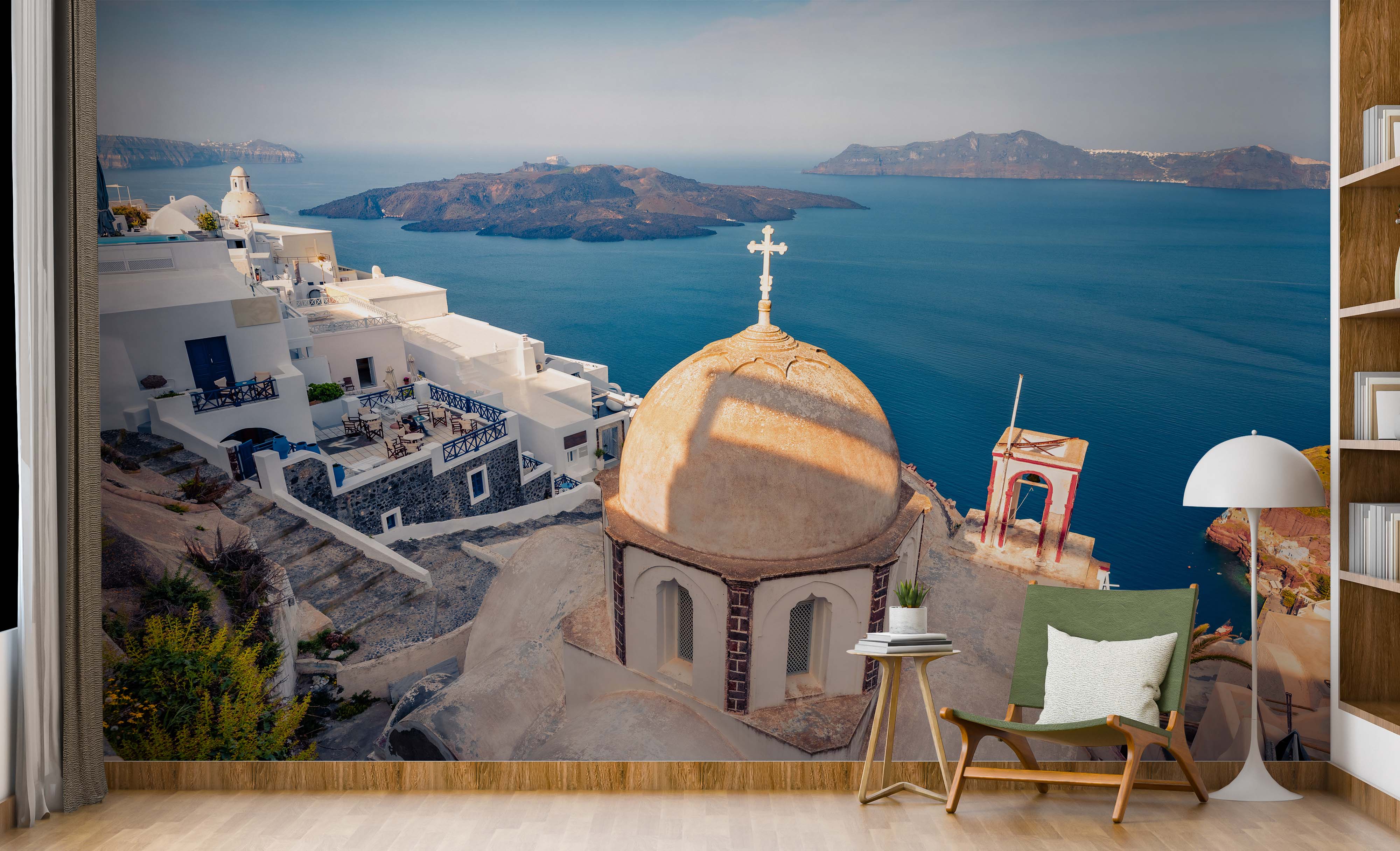 A scenic mural of a Greek island village with whitewashed buildings, a church dome, and a view of the deep blue sea.