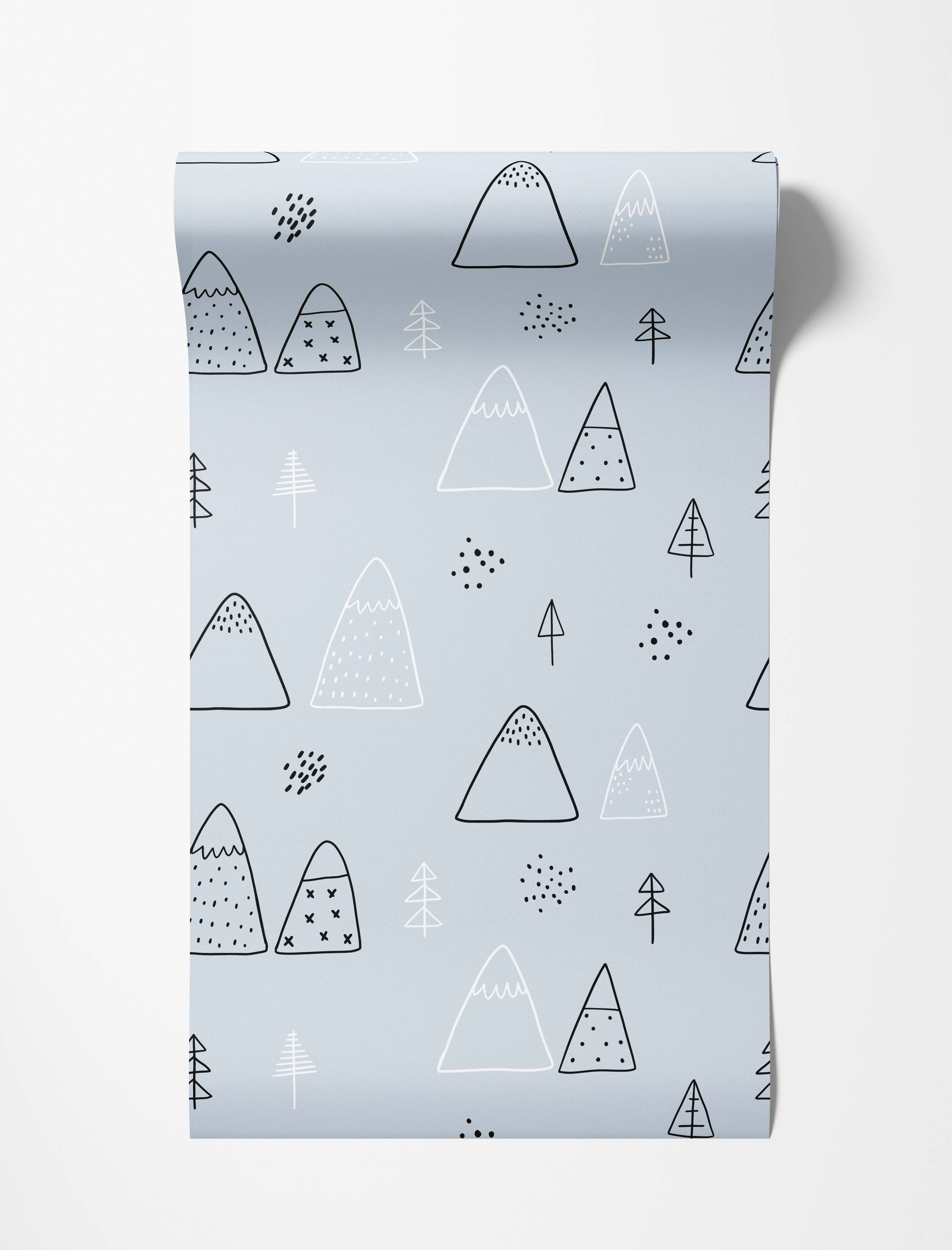 Scandinavian style wallpaper featuring a hand-drawn pattern of mountains and trees in black and white on a pale blue background.