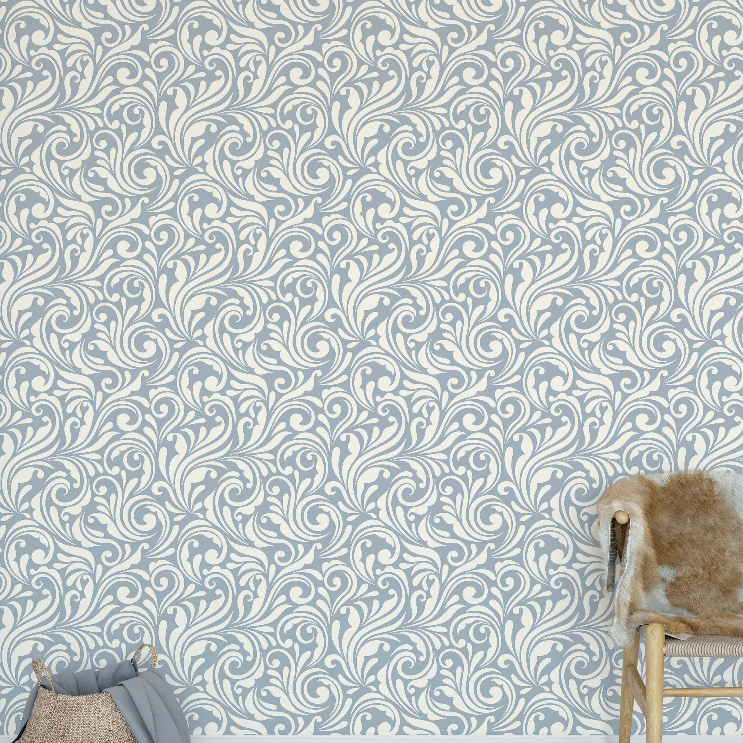 Wallpaper featuring an ornate, scrolling pattern with cream flourishes on a light blue background.