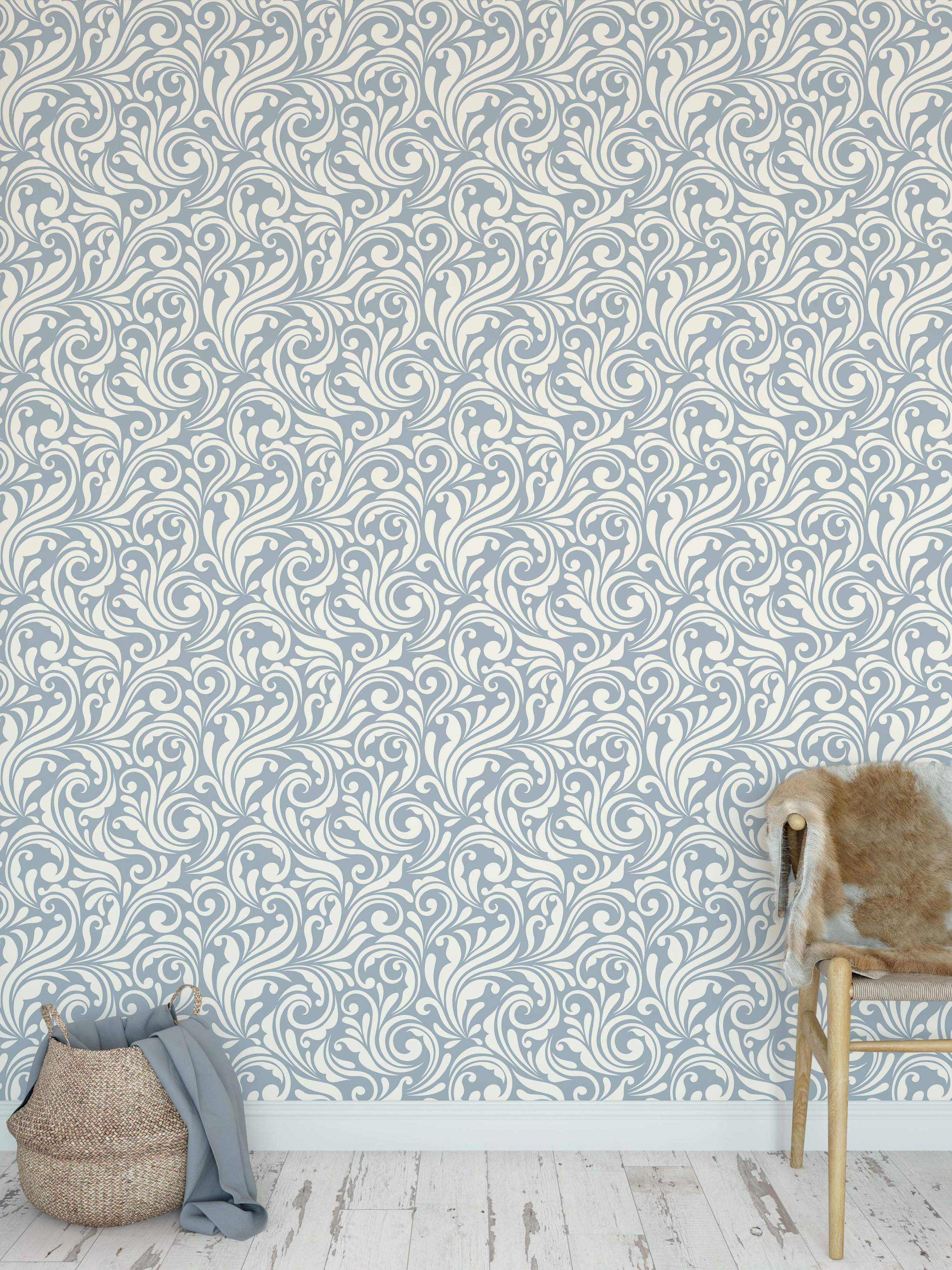 Wallpaper featuring an ornate, scrolling pattern with cream flourishes on a light blue background.
