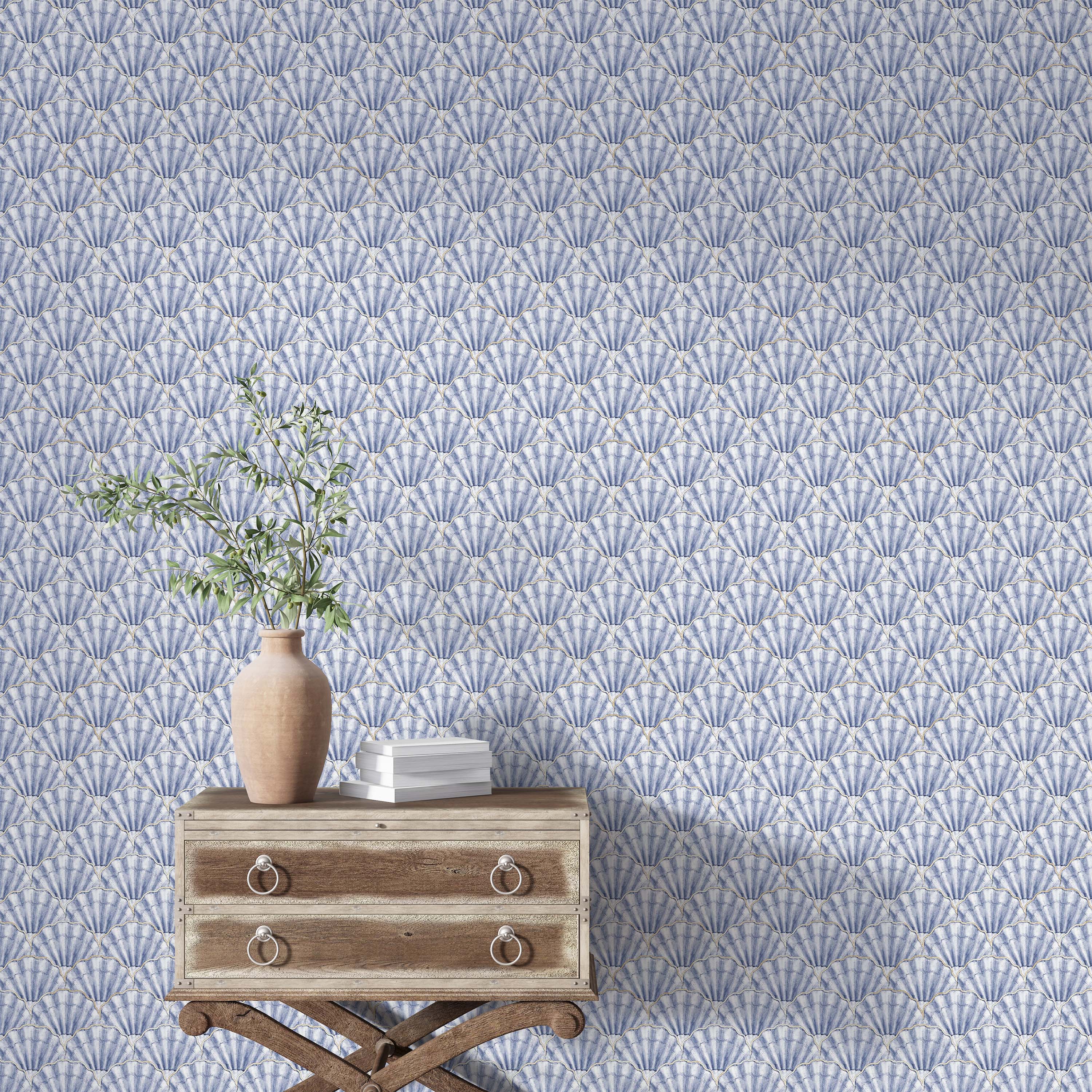 Wallpaper featuring a repeating fan-shaped seashell pattern in shades of blue and white, with subtle gold outlines.