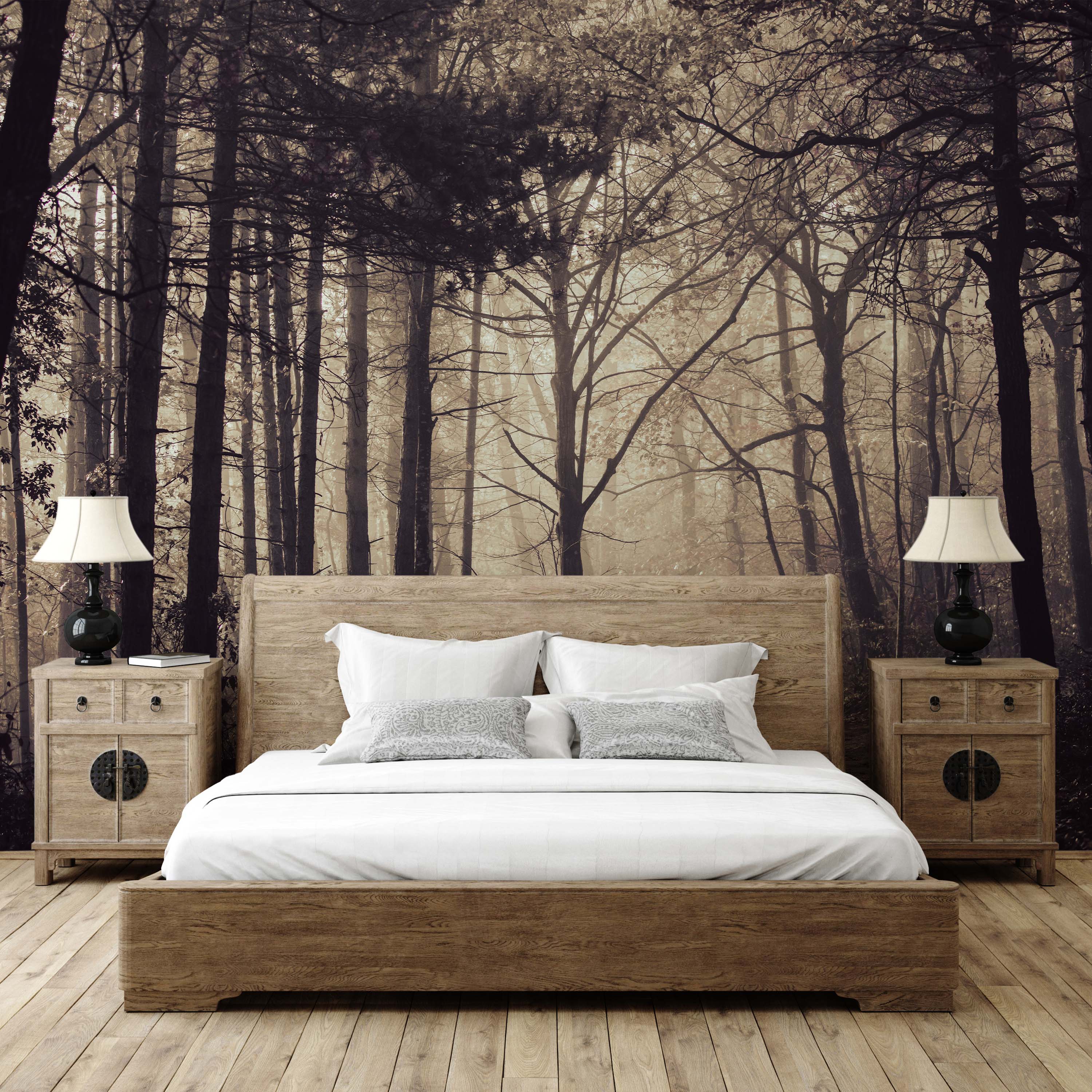 Mural of a dense, misty forest in sepia and monochrome tones, with dark trees in the foreground creating a sense of depth.
