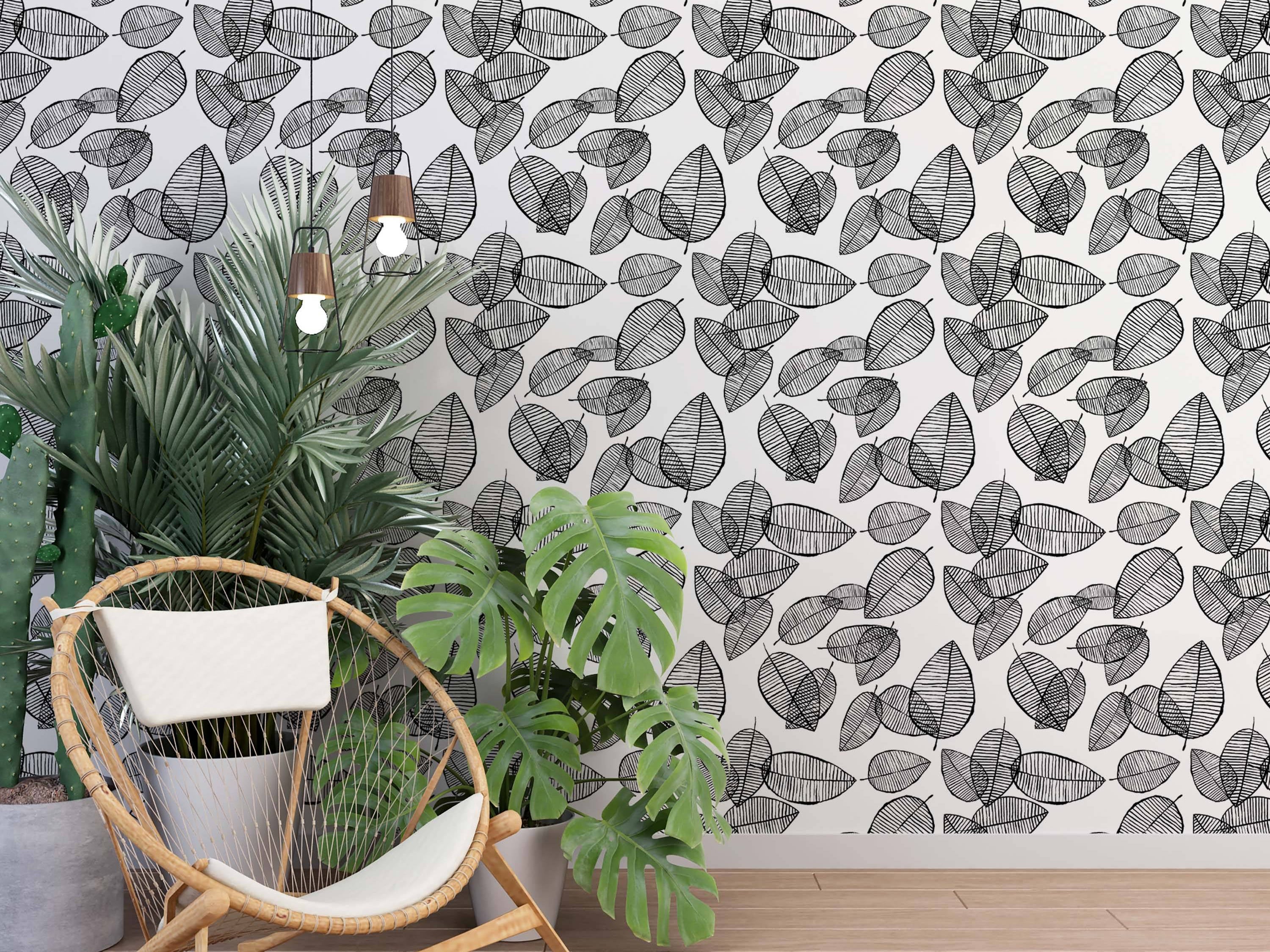 Sketch-style wallpaper with overlapping black leaves, detailed with horizontal stripes, on a white background.