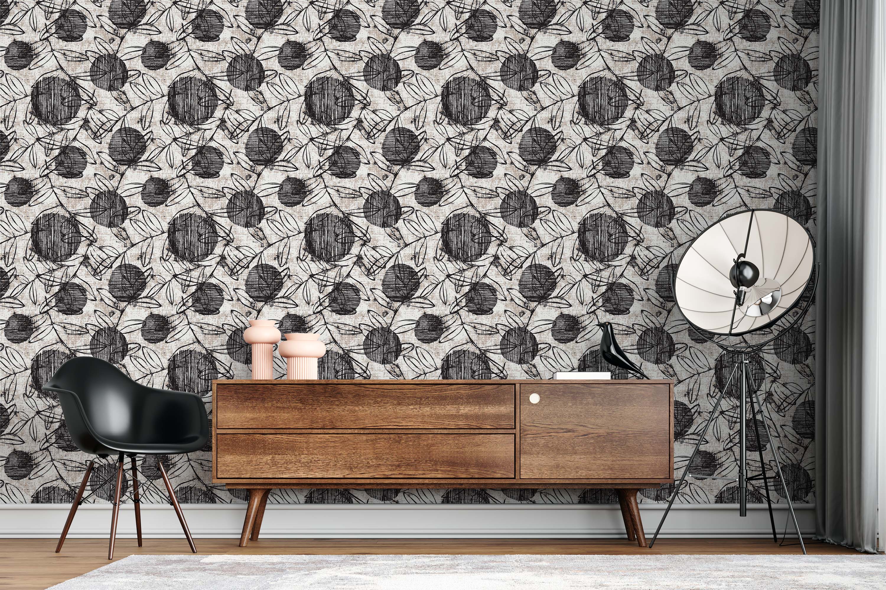 Wallpaper with a sketchy pattern of black scribbled circles and outlined leaves on a textured beige and off-white background.