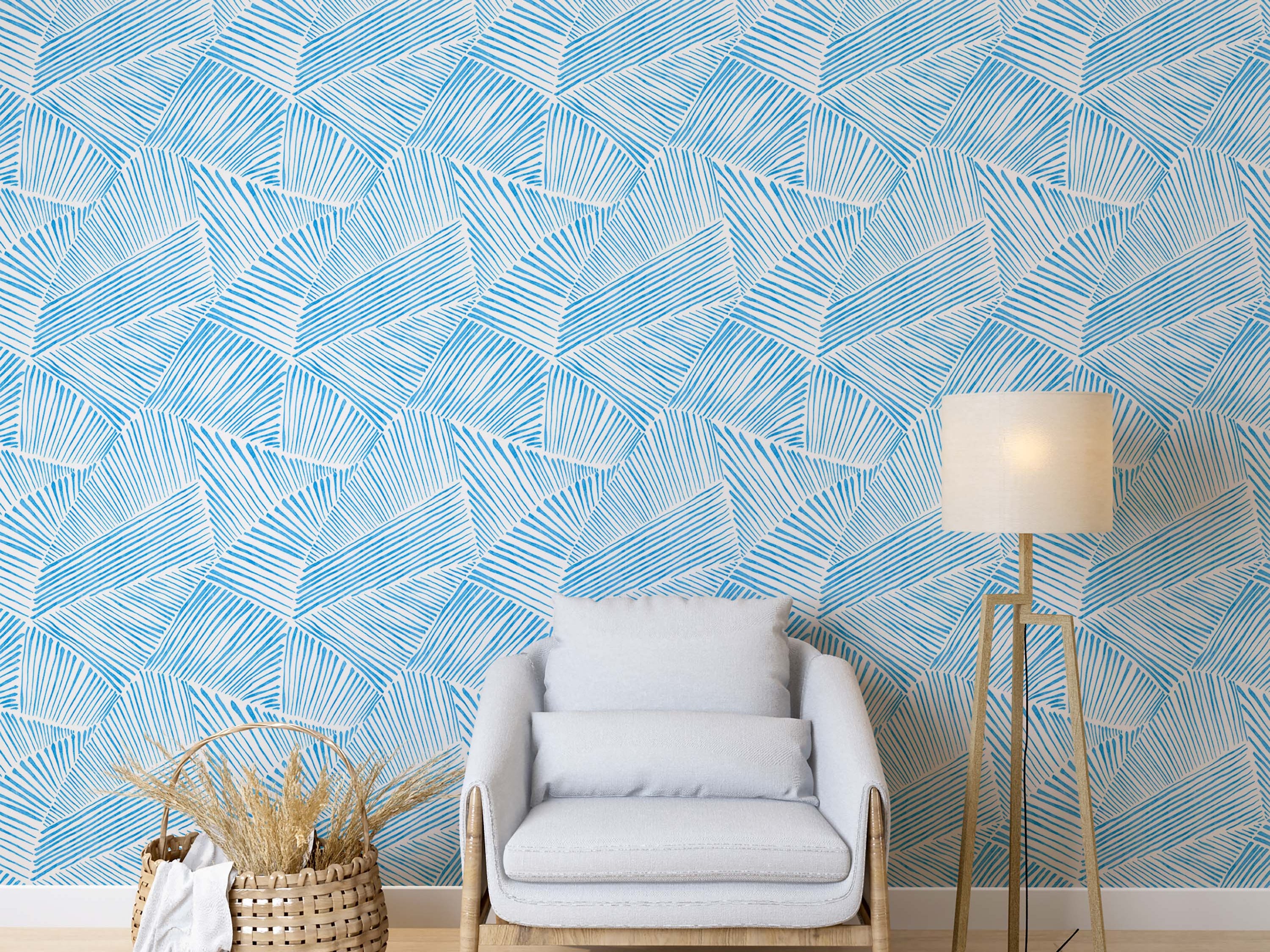 Blue and white wallpaper featuring a sketchy, hand-drawn pattern of lines forming abstract geometric blocks.