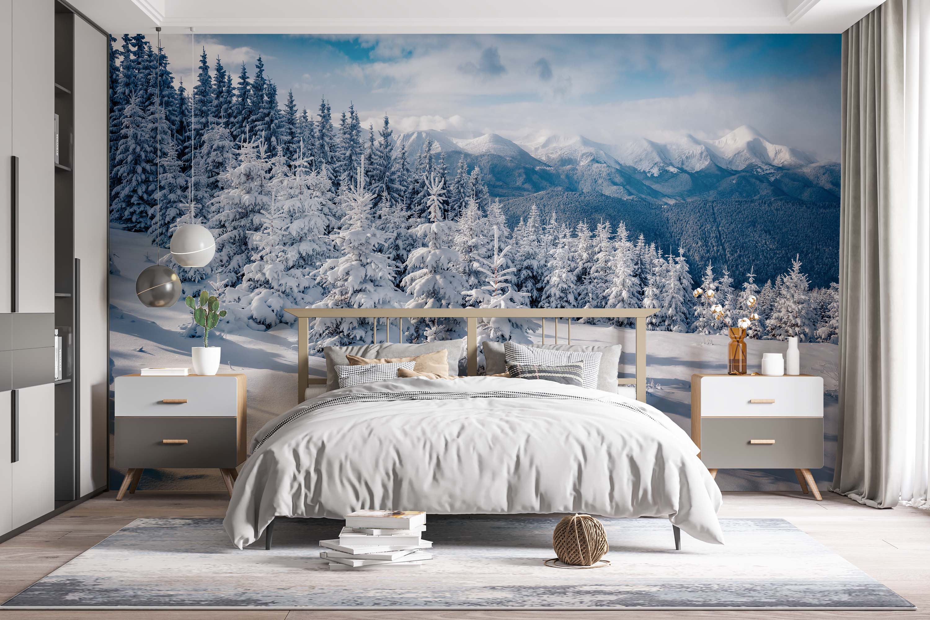 A scenic wall mural of a winter landscape, featuring snow-covered pine trees with a misty mountain range in the background.