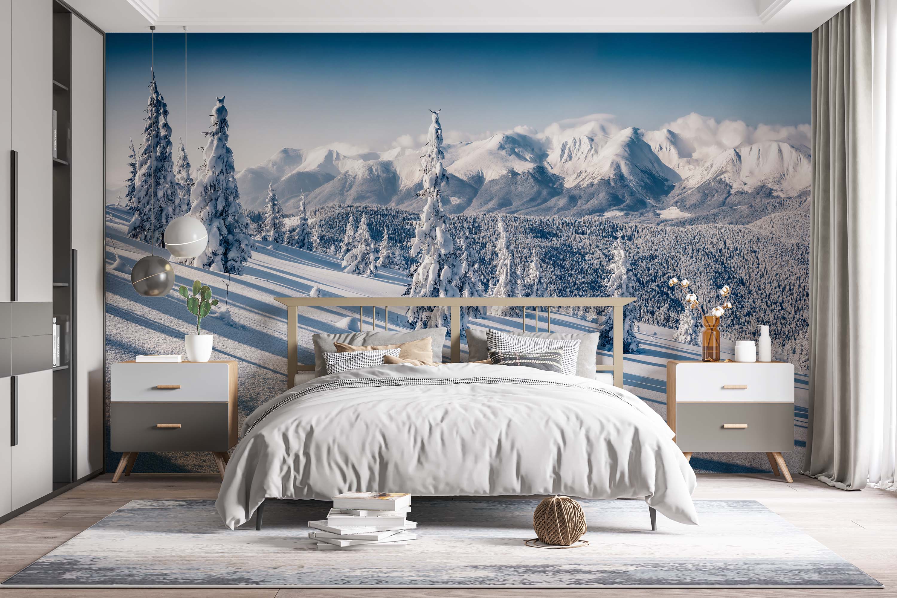 A photorealistic mural of a vast winter landscape with snow-covered mountains and pine trees under a bright blue sky.