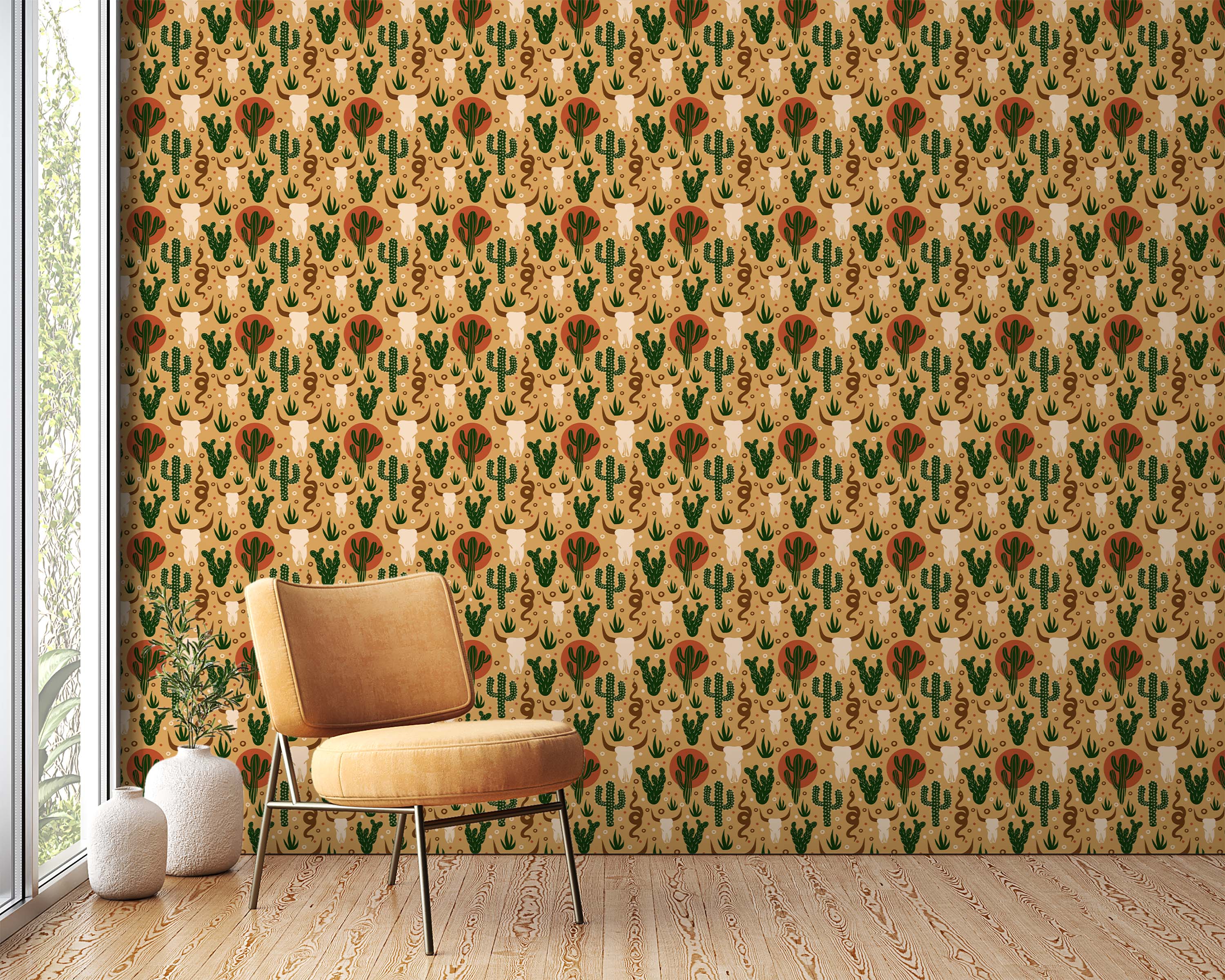 Southwestern wallpaper with a repeating pattern of green cacti, bull skulls, snakes, and terracotta suns on a tan background.