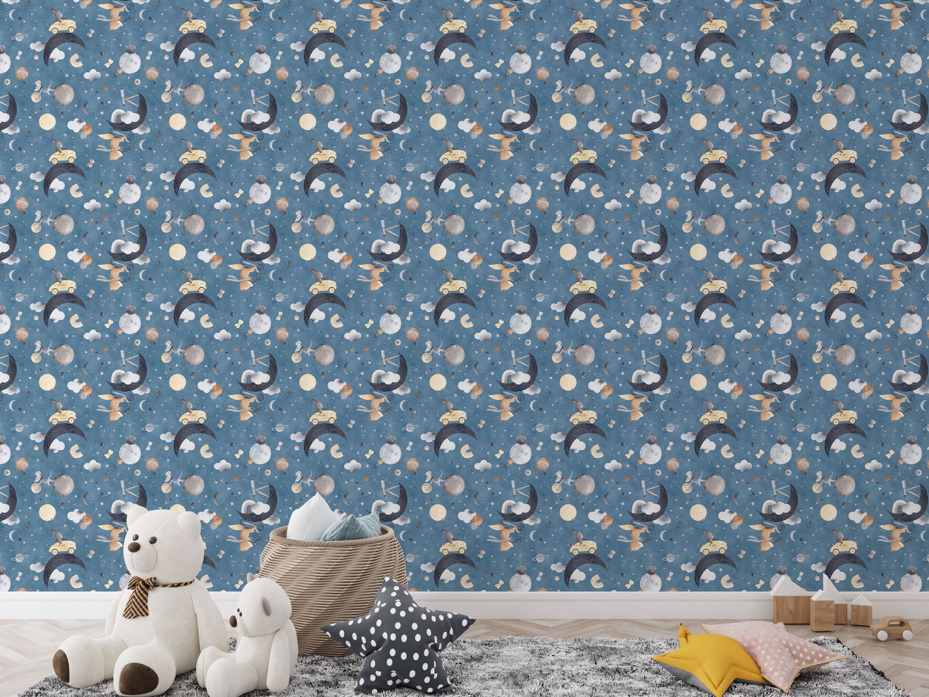 Whimsical children's wallpaper with watercolor rabbits, moons, planets, stars, and clouds on a blue, starry background.