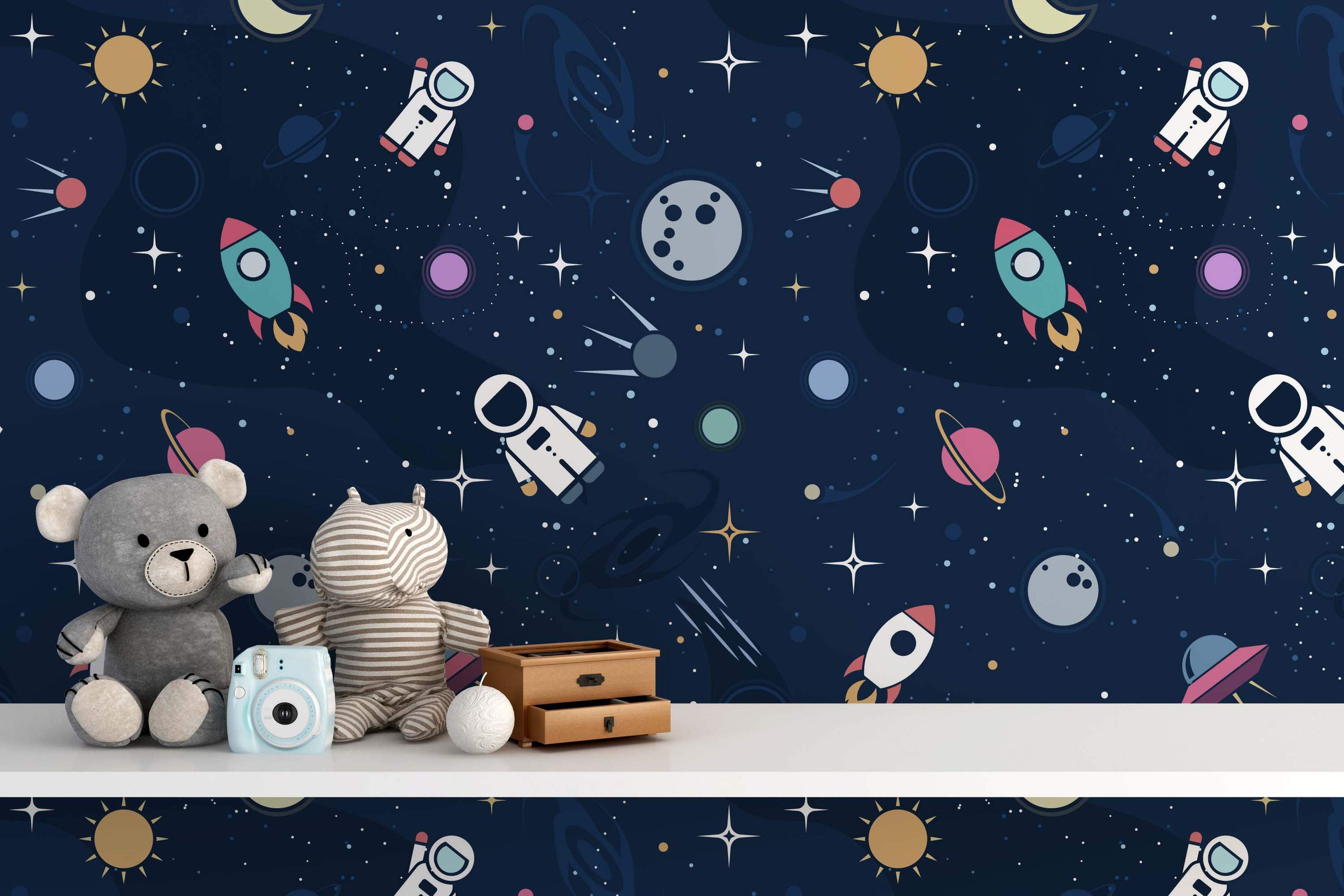 Dark blue space wallpaper featuring a repeating pattern of cartoon astronauts, rockets, planets, suns, and stars.