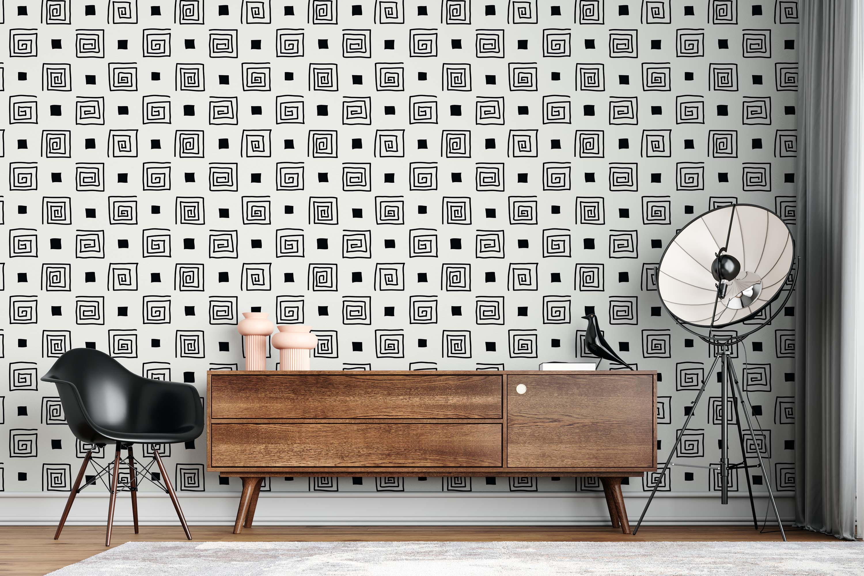 Wallpaper with a hand-drawn pattern of black square spirals and solid squares alternating on a light background.