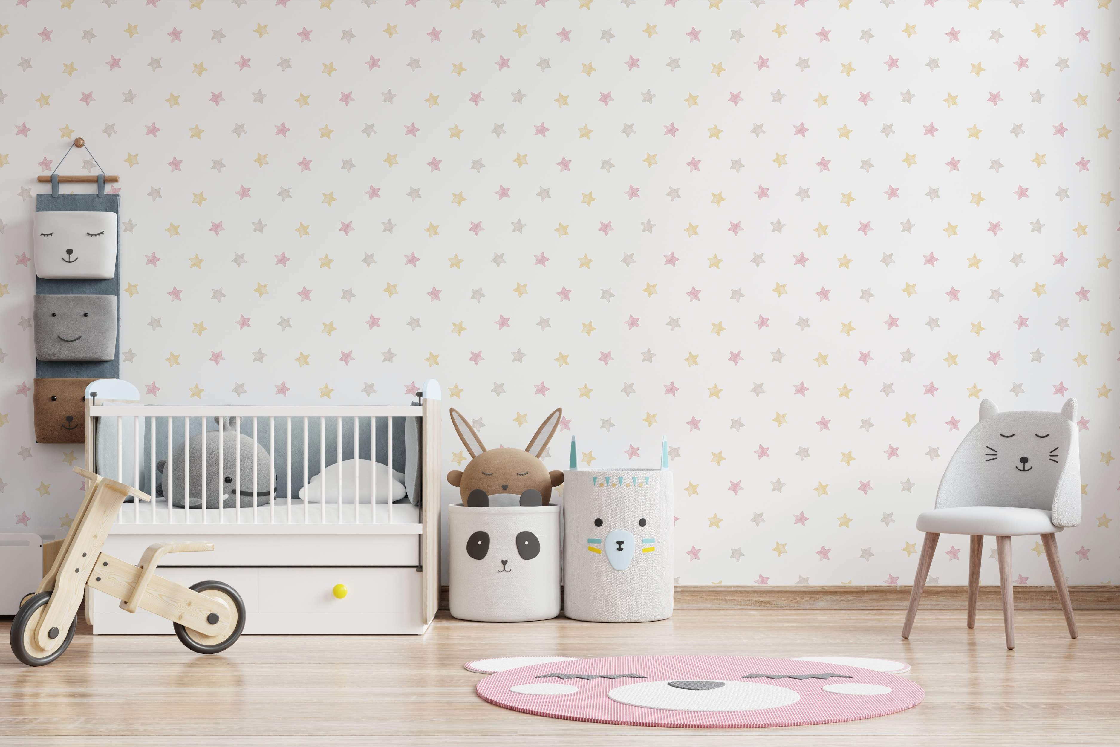 Wallpaper featuring a repeating pattern of soft pink, yellow, and gray watercolor stars on a white background.