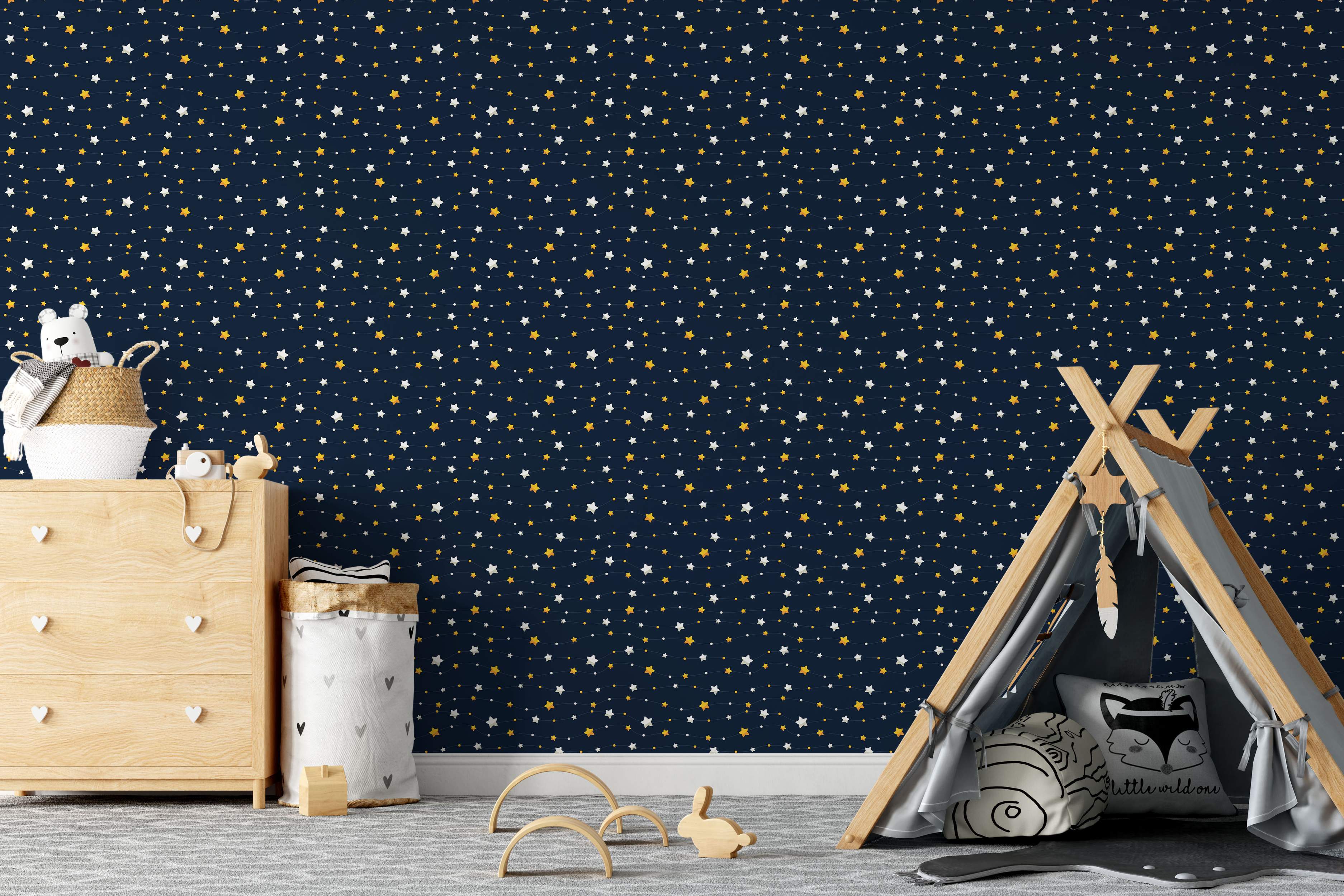 Wallpaper with a repeating pattern of white and yellow stars and dots scattered across a dark navy blue background.