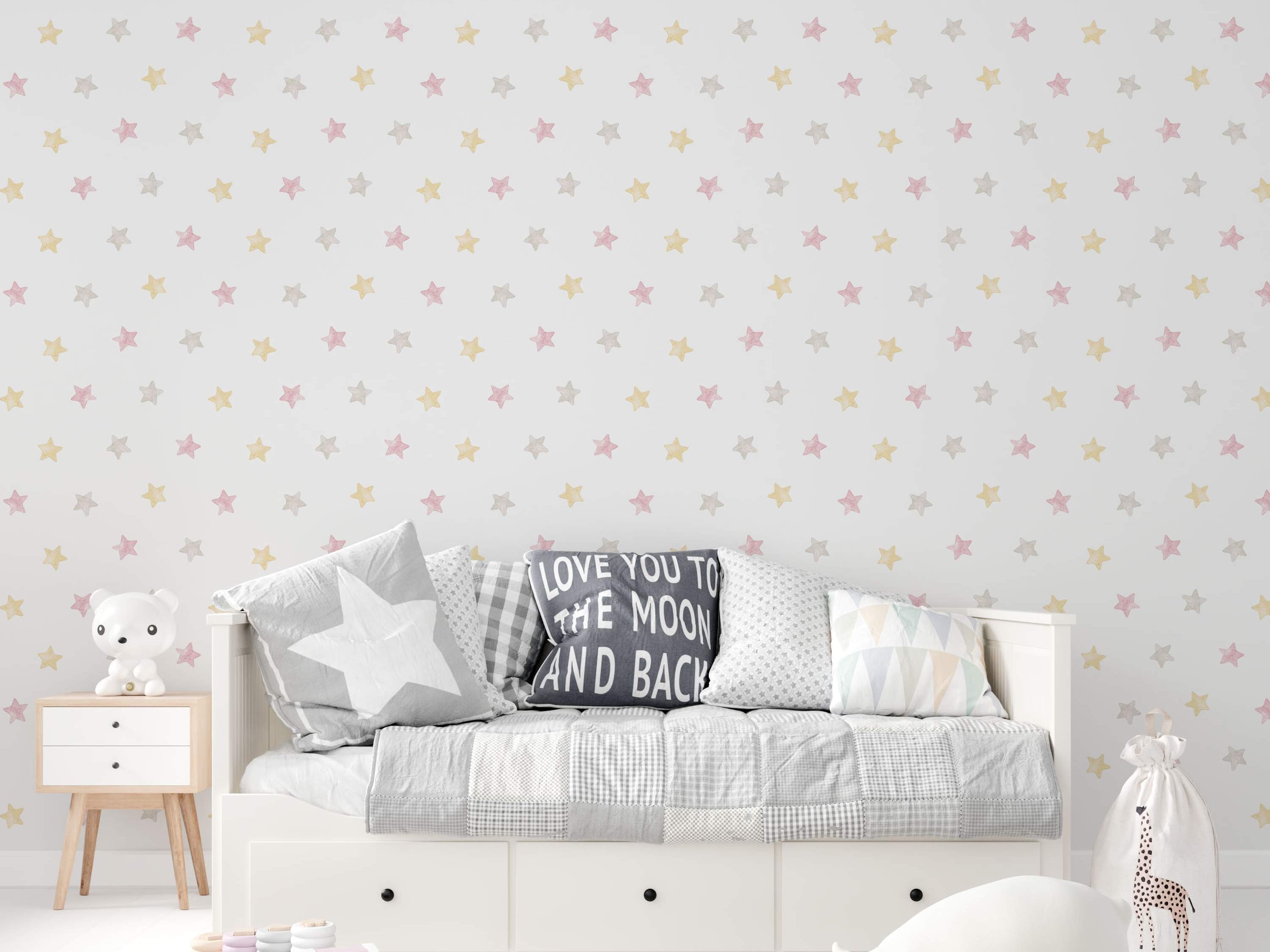 Wallpaper featuring a repeating pattern of small, soft pink, yellow, and gray stars on a white background.