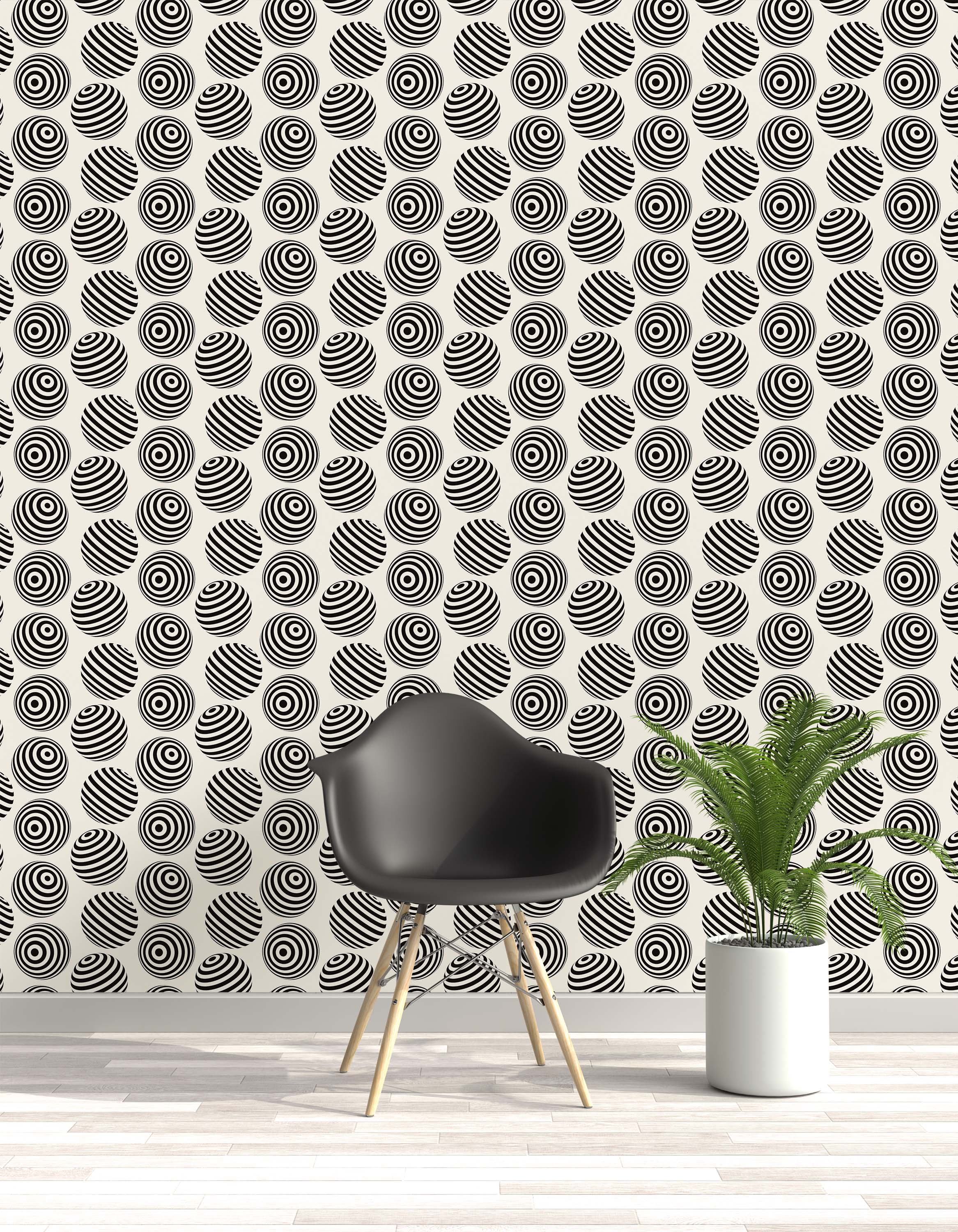 Wallpaper featuring an op art pattern of black and white spheres with stripes and concentric circles on a cream field.
