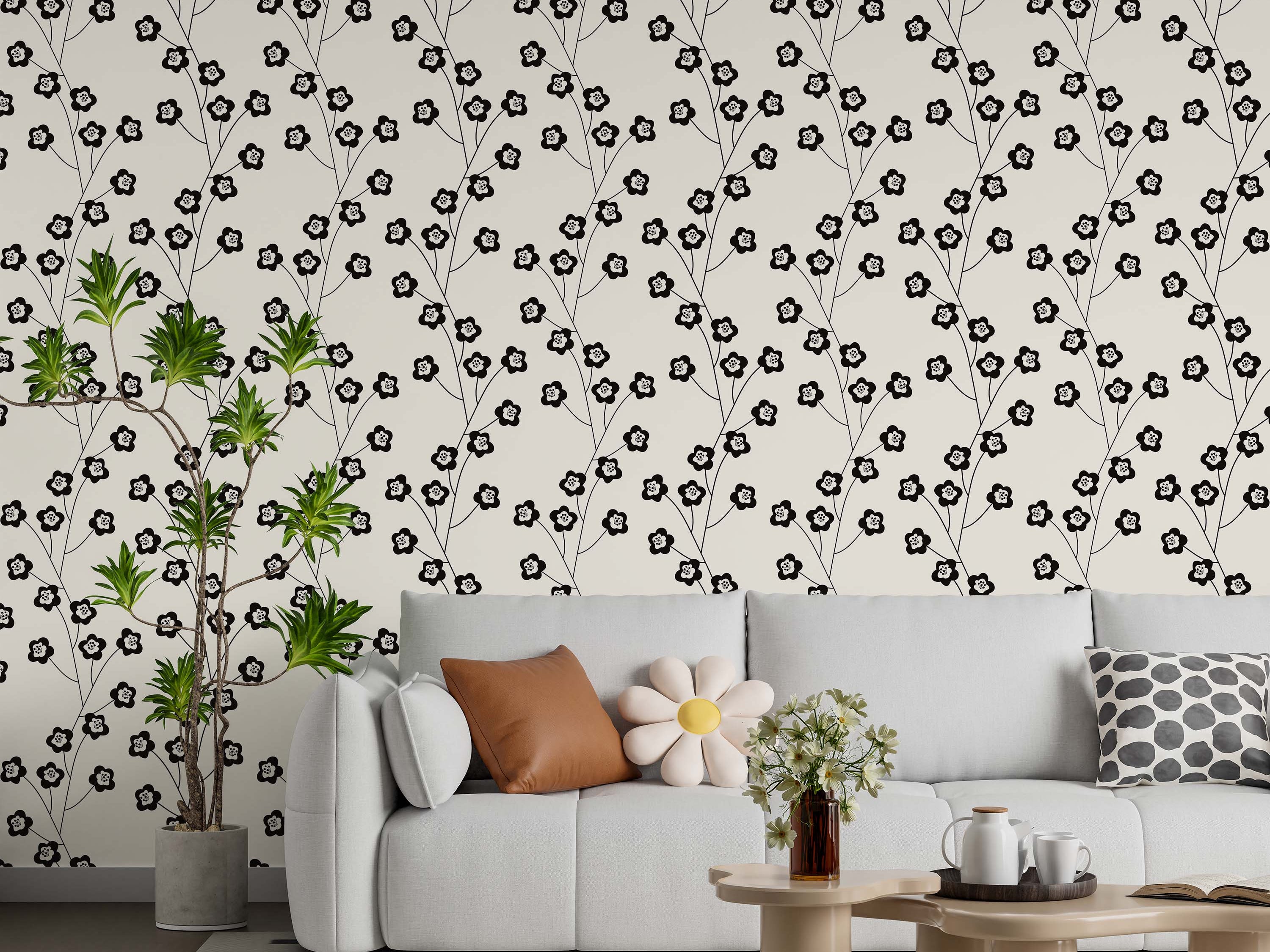 Stylized black floral branches wallpaper with white, black-dotted flower centers, repeating on an off-white background.