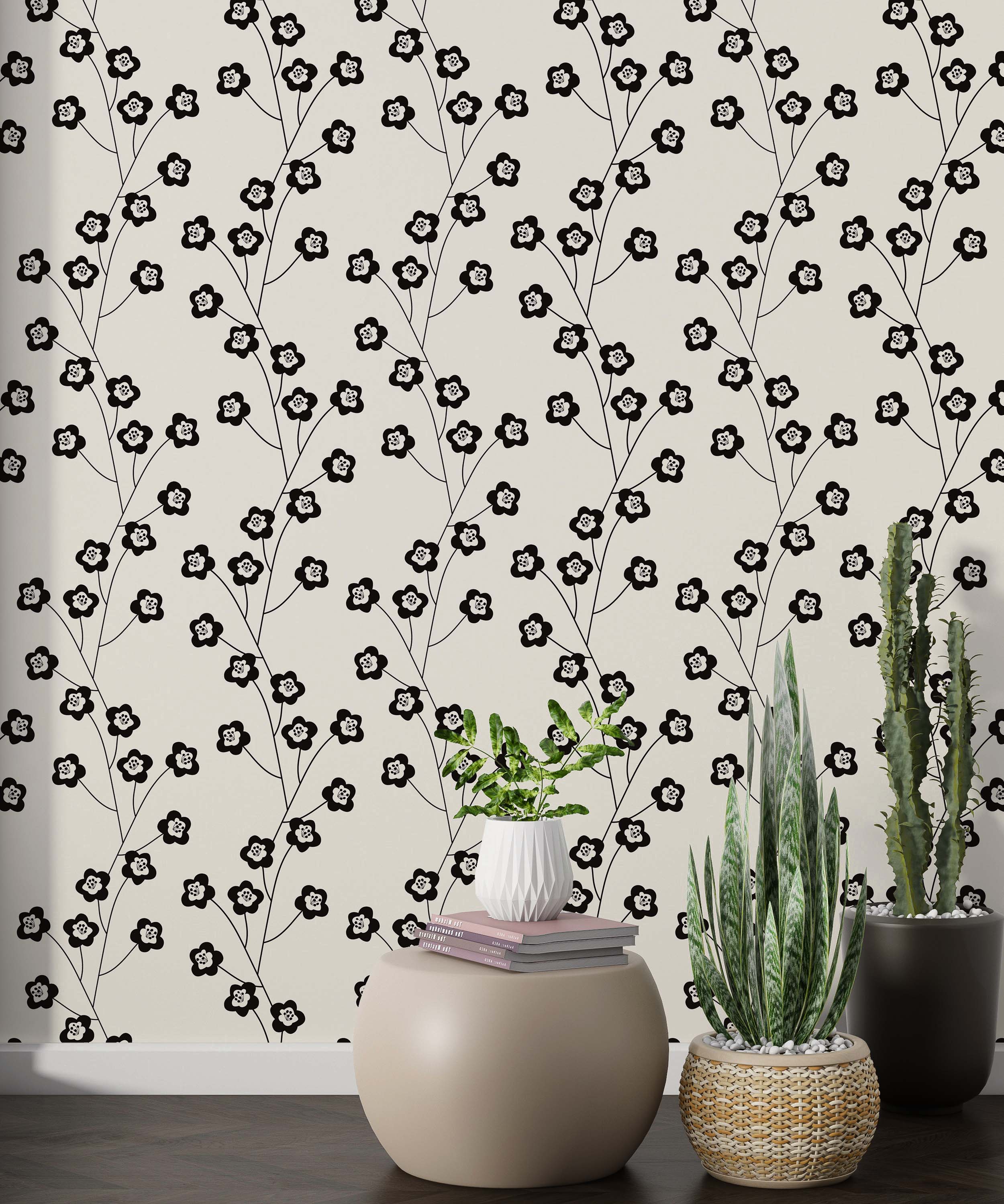 Repeating wallpaper featuring stylized black floral vines with white-centered flowers on a light beige background.